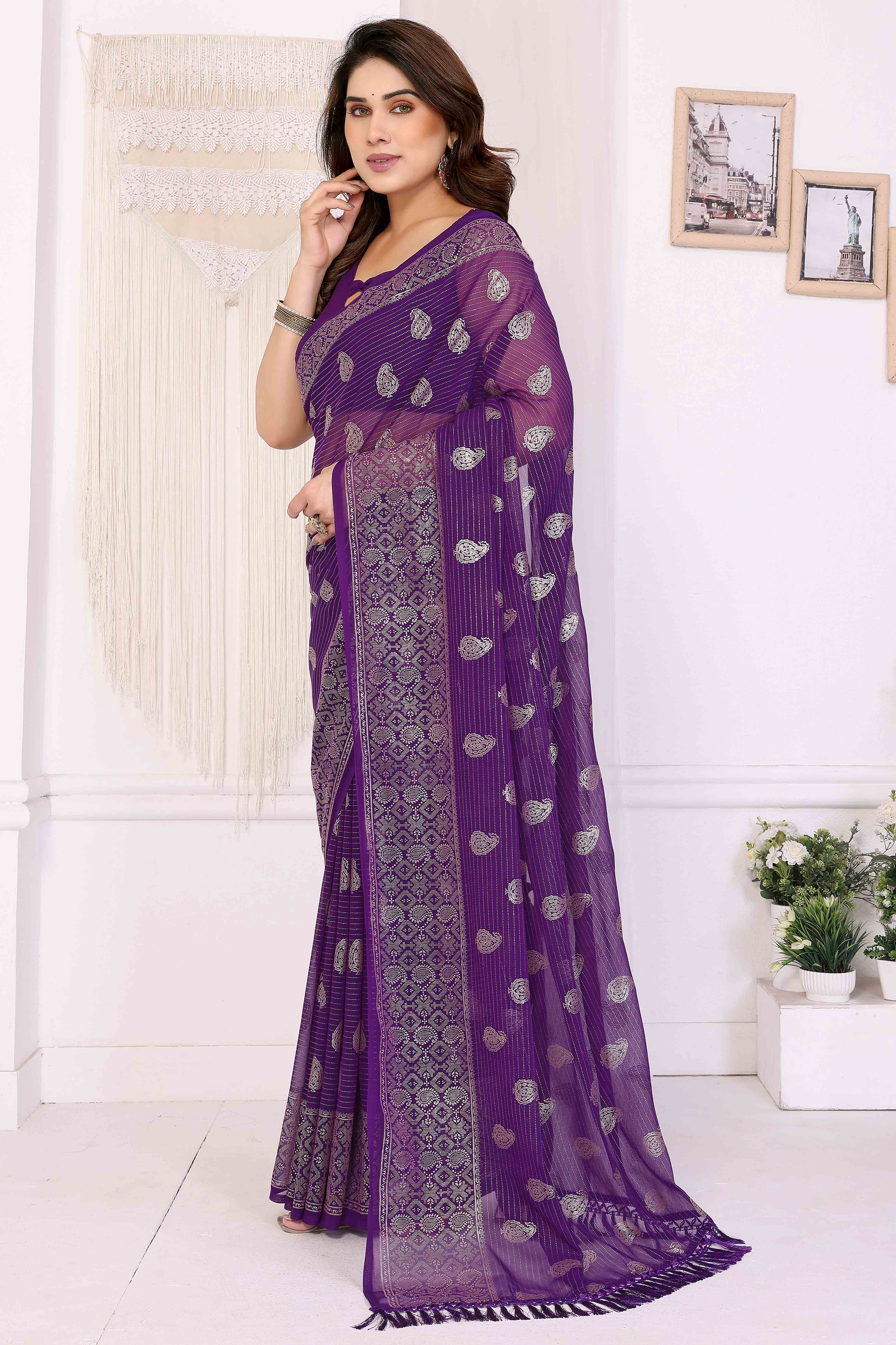 Purple Foil Printed Georgette Saree Enhanced With Delicate Lace Border & Elegant Tassel