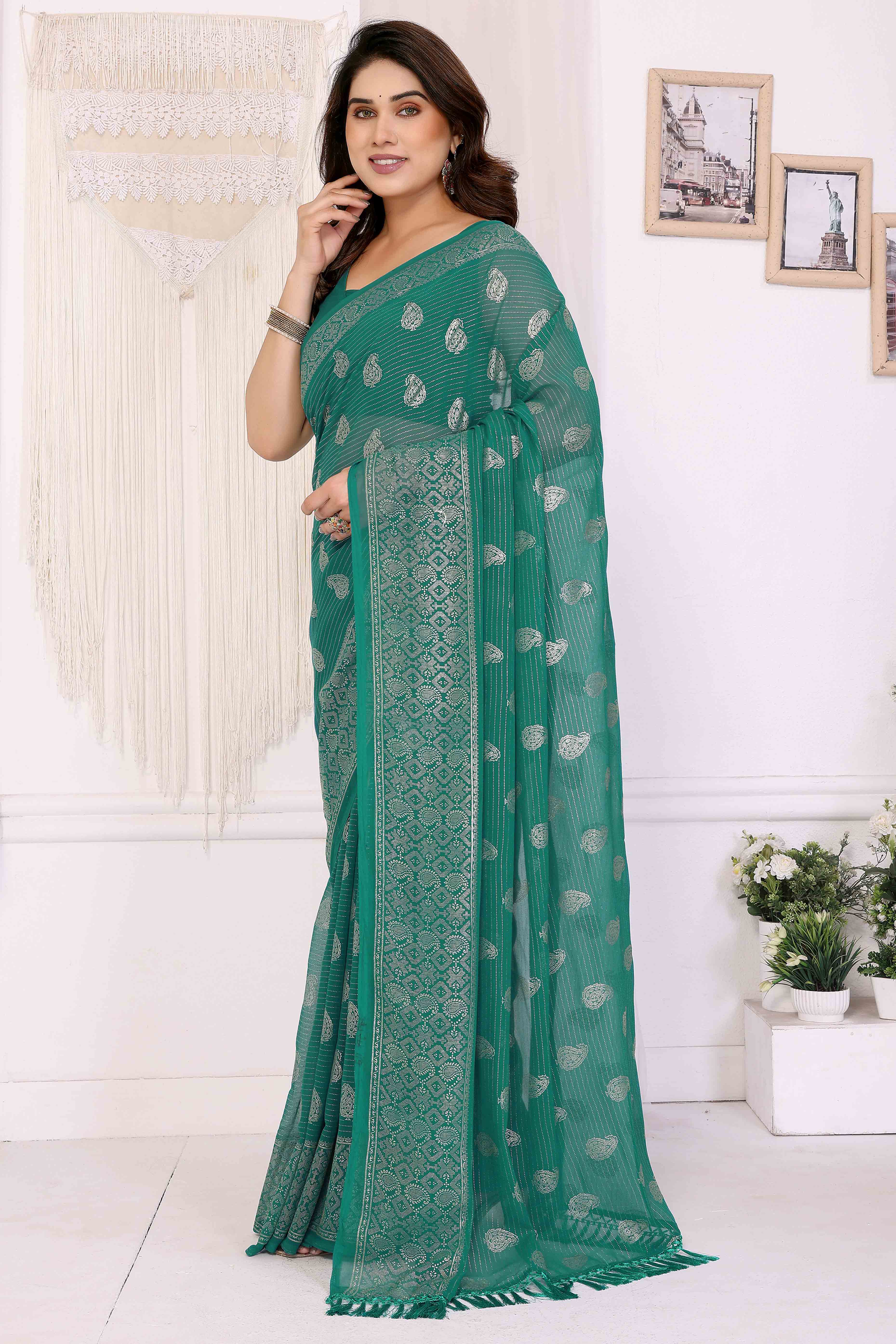 Rama Green Foil Printed Georgette Saree Enhanced With Delicate Lace Border & Elegant Tassel