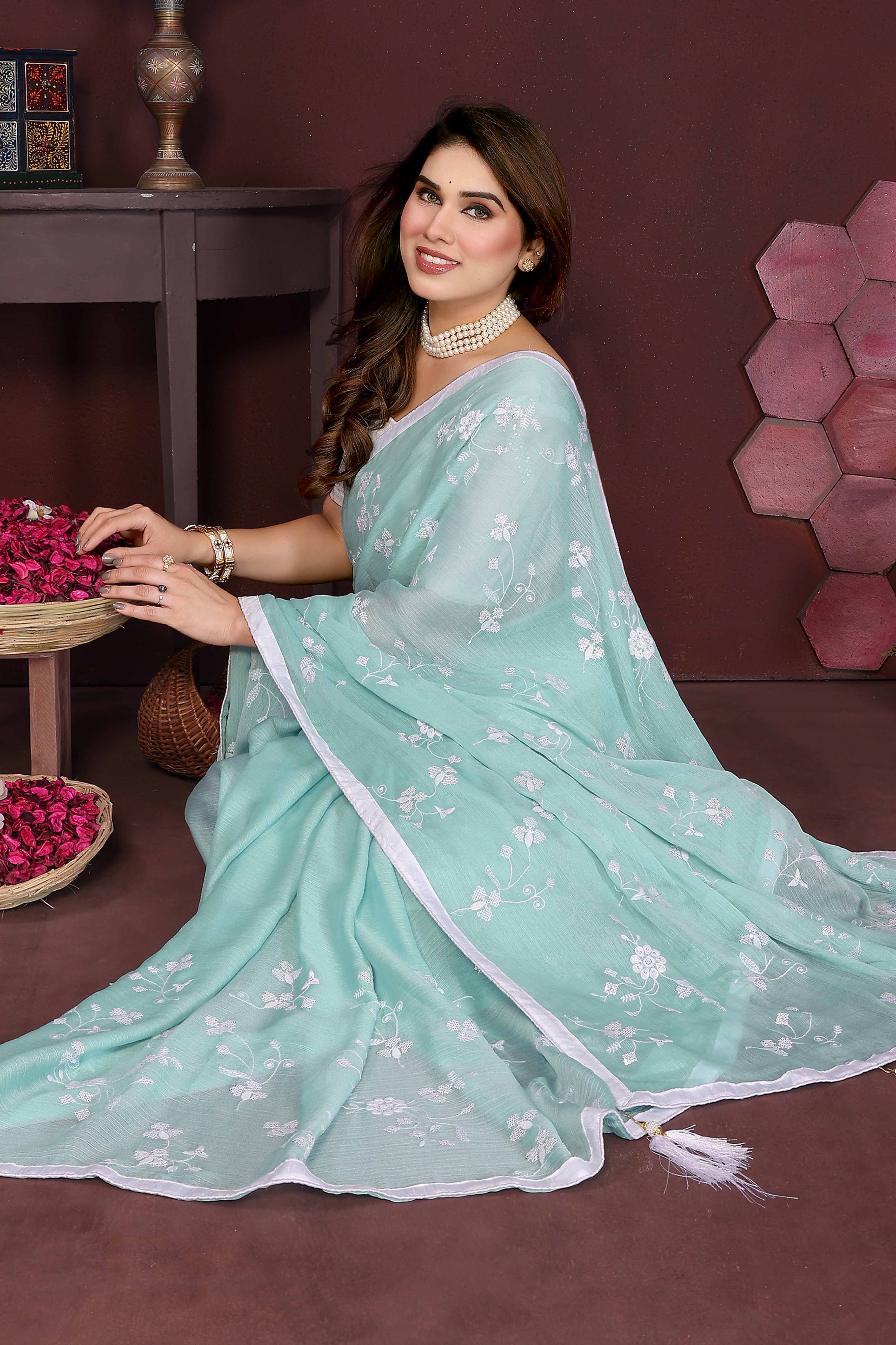 Pale Turquoise Bloom Saree adorned with Moss Floral Embroidery and Delicate Lace Border