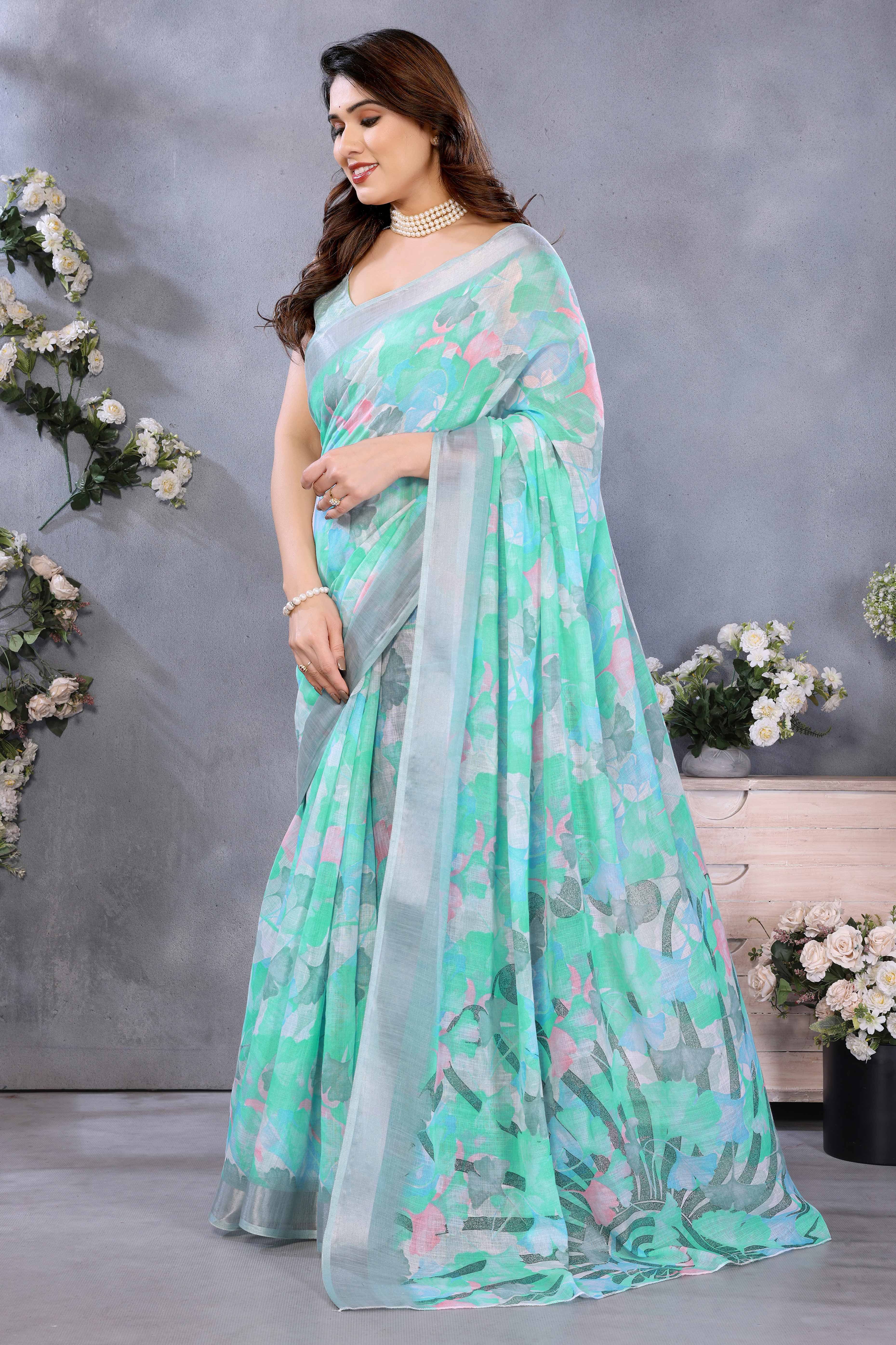 Turquoise Floral Printed Linen Saree Accented With A Classic Patta Border