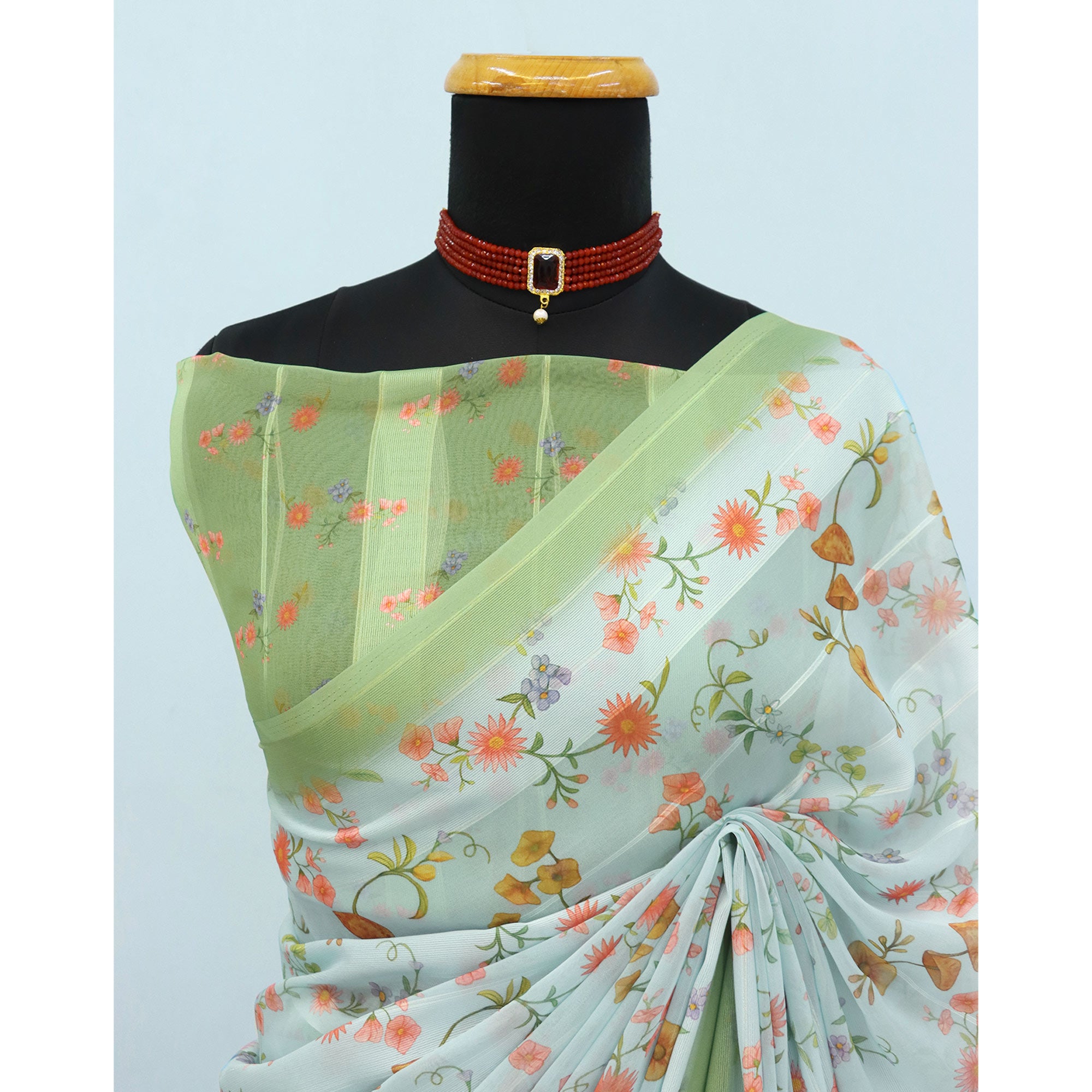 Sky Blue Bloom Floral Digital Printed Georgette Saree Accentuated With Graceful Zari Stripes