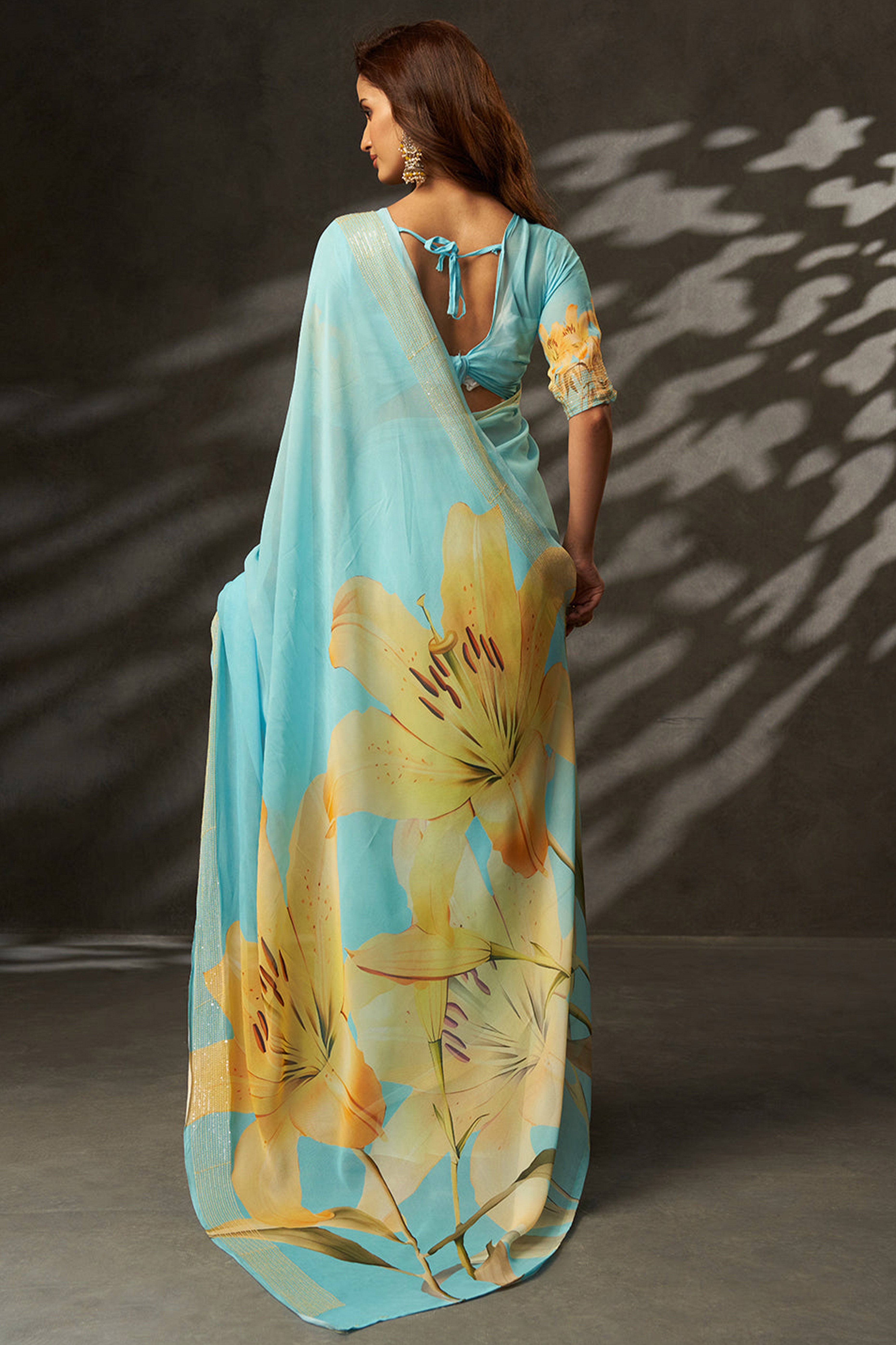 Graceful Sky Blue Floral Digital Print Saree in Georgette With Artistic Crochet Border Work