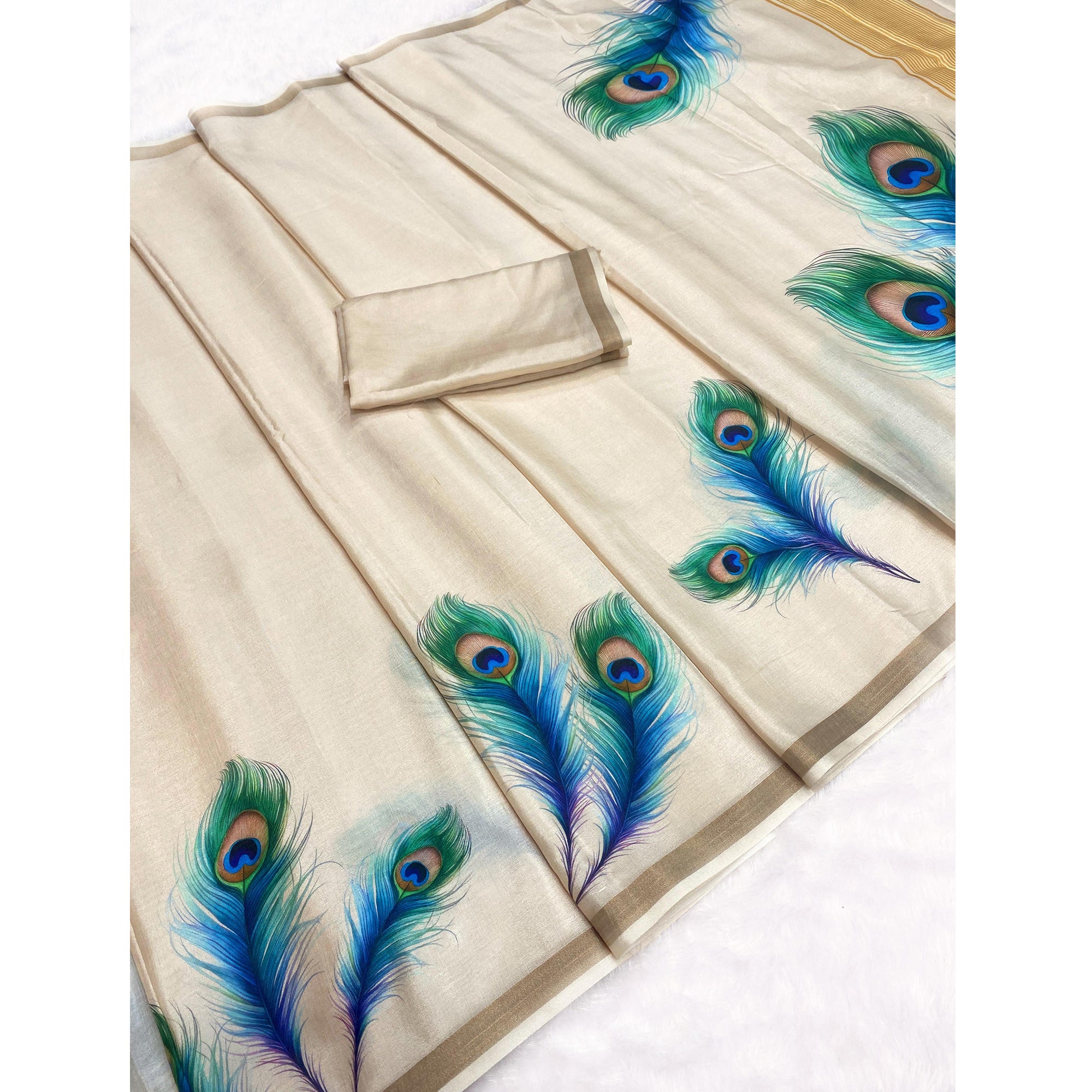 Charming Cream Soft Tussar Cotton Silk Saree With Peacock Feathers Print