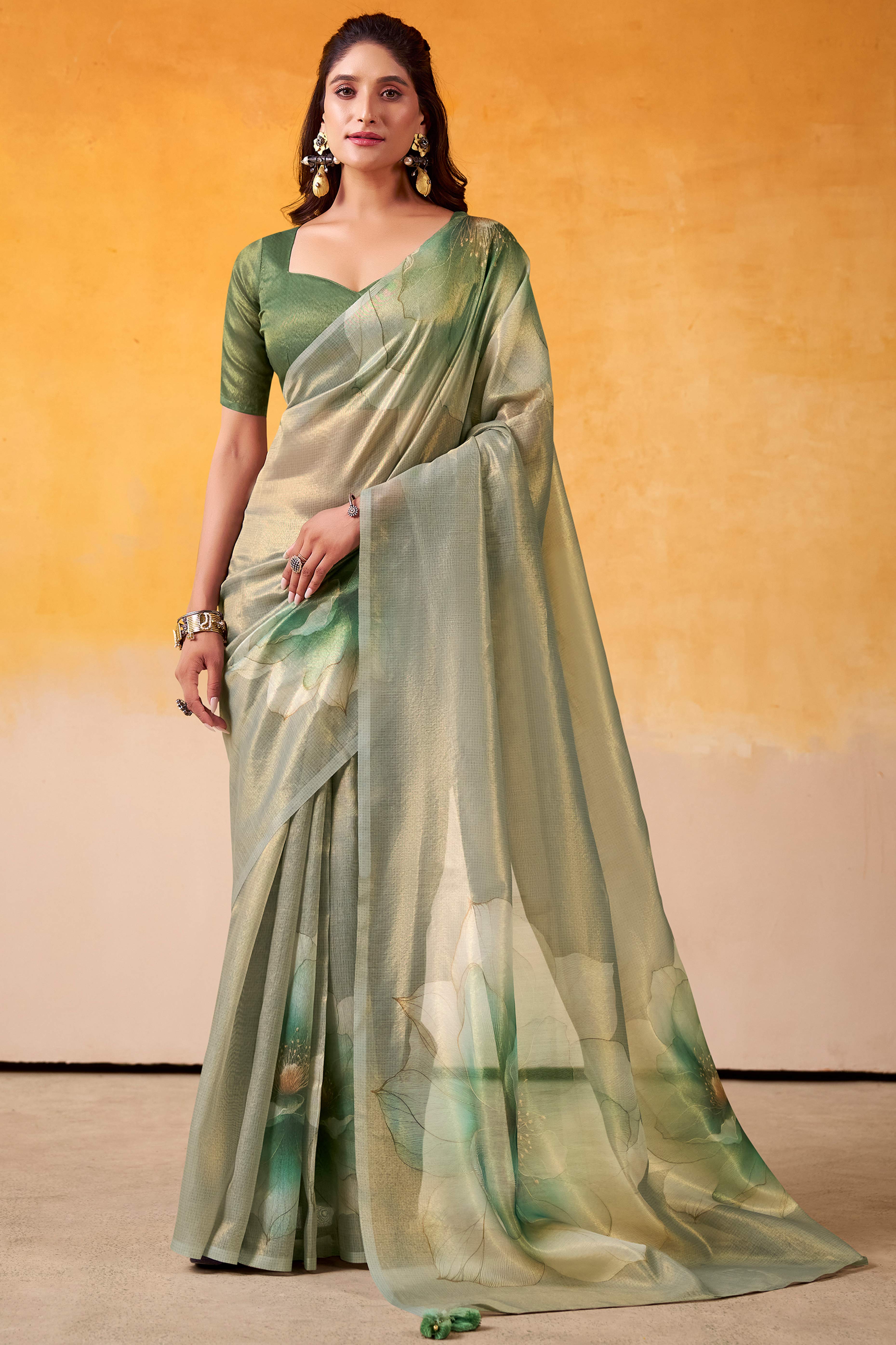 Sophisticated Dusty Green Floral Digital Print Tissue Saree Enhanced With Handmade Tassels