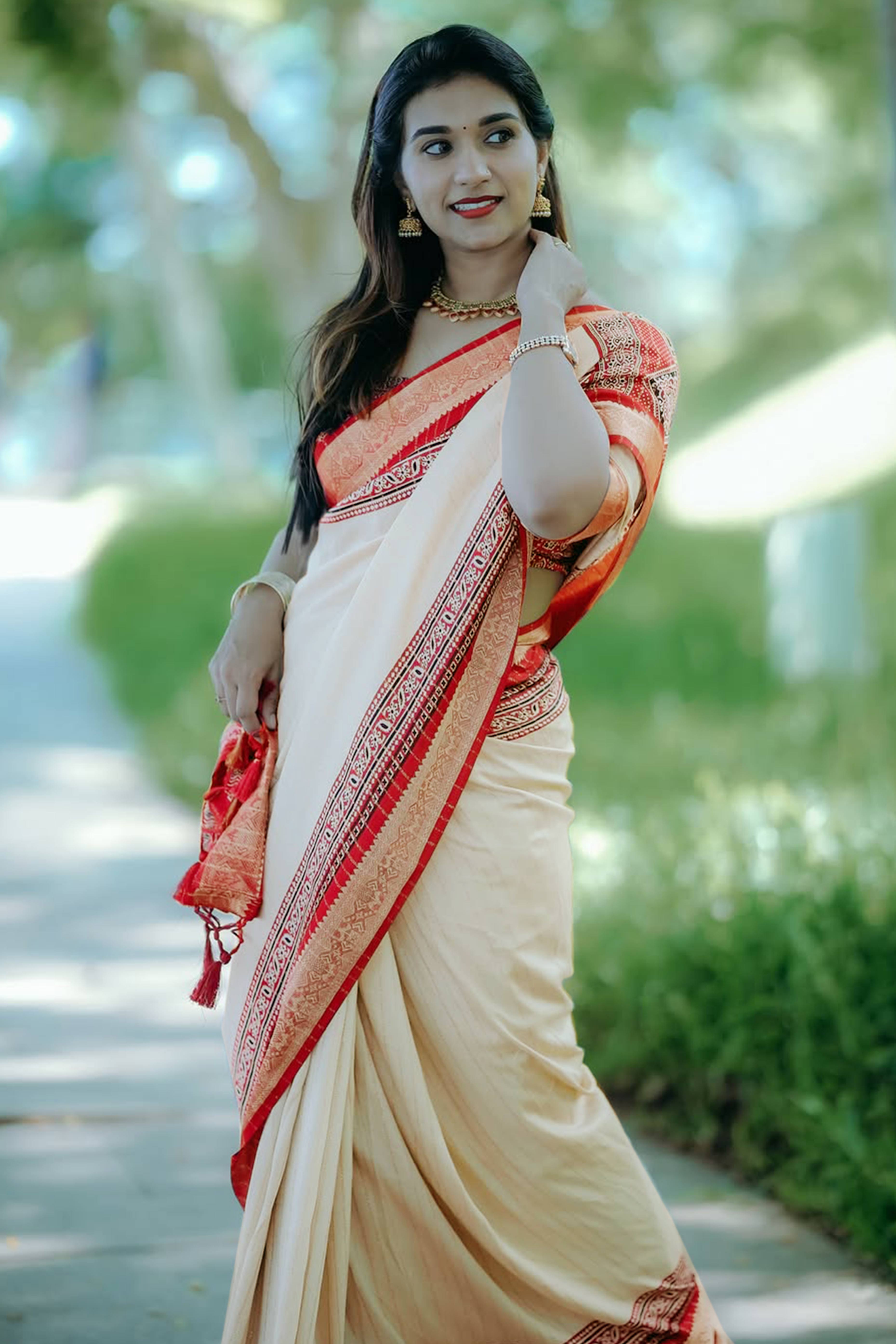 Graceful Light Chikoo Dola Silk Saree Featuring Striped Weave & Floral Border