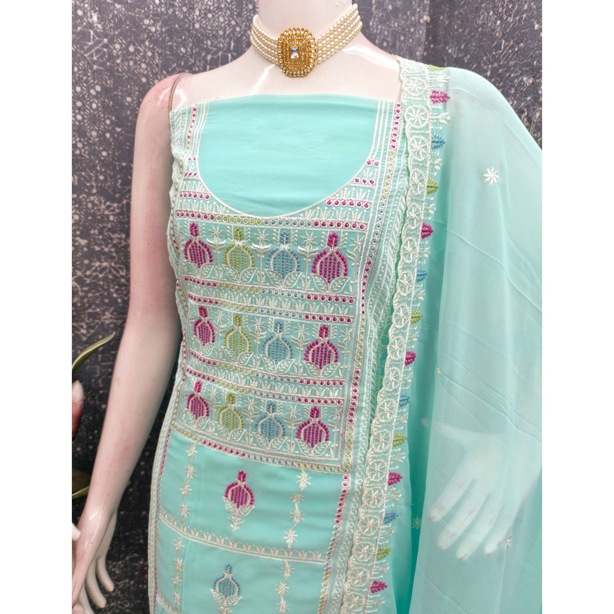 Sophisticated Turquoise Georgette Dress Material Accented With Ornate Floral Thread Embroidery