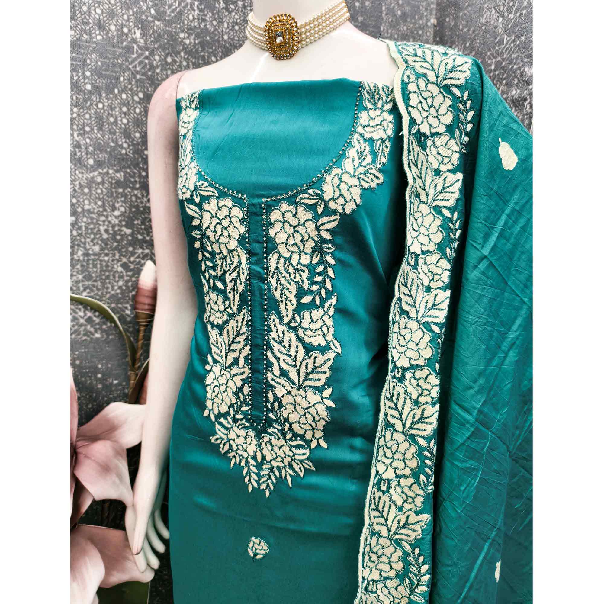 Teal Green Rich Viscose Dress Material Highlighted with Refined Floral Thread Embroidery