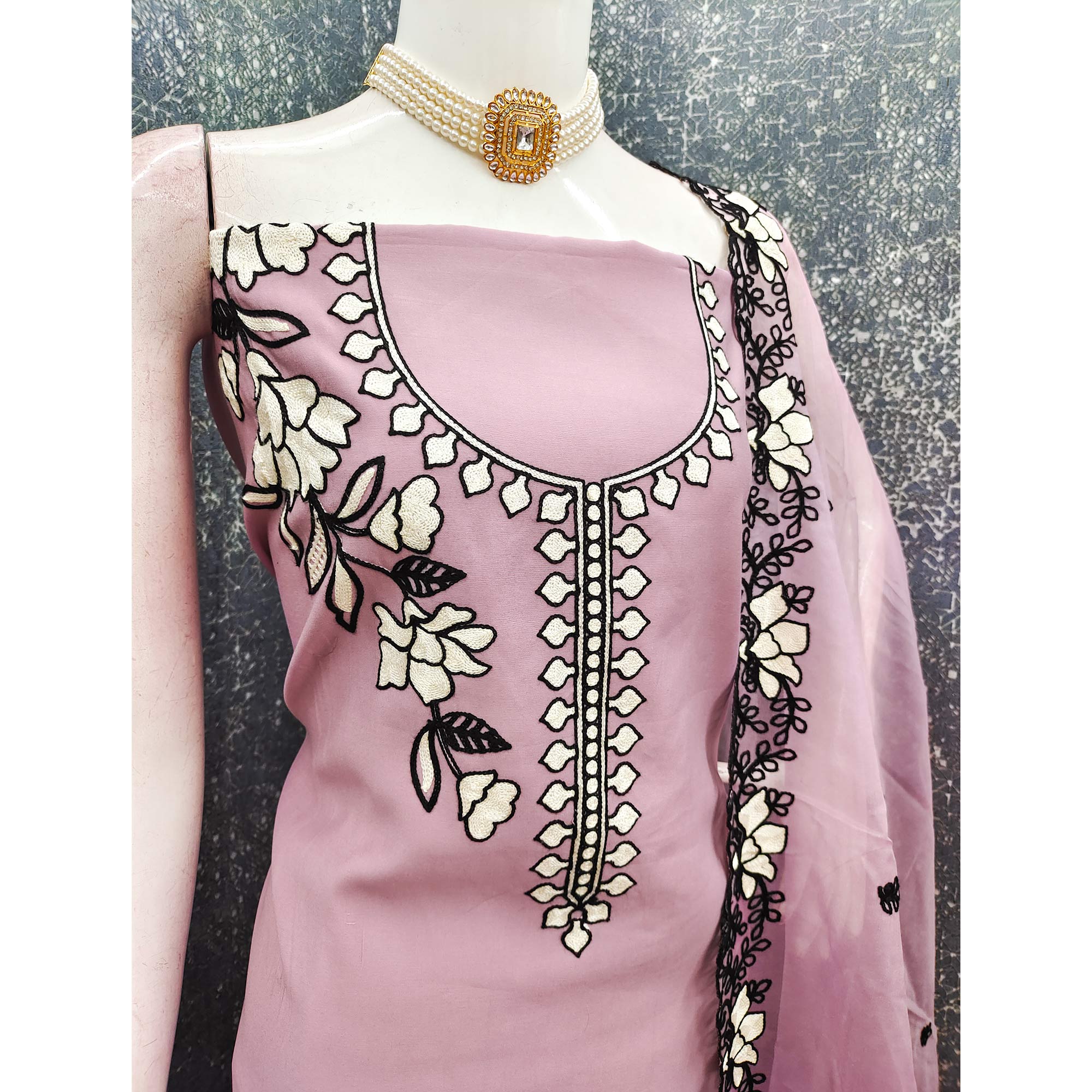 Graceful Onion Pink Floral Viscose Dress Material Enhanced With Intricate Thread Embroidery Work