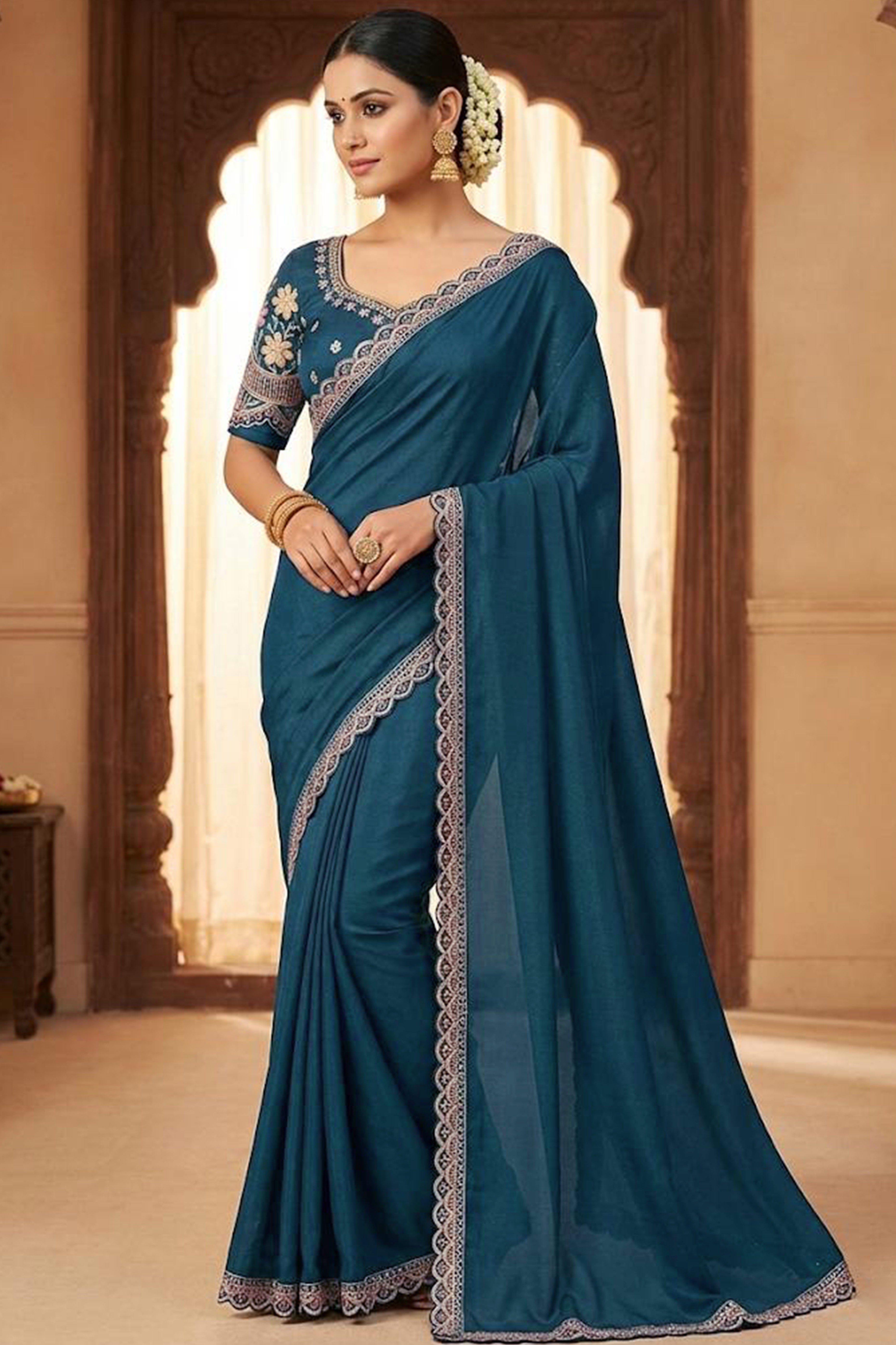 Teal Solid Georgette Saree With Embroidered Blouse Piece And Embroidered Border