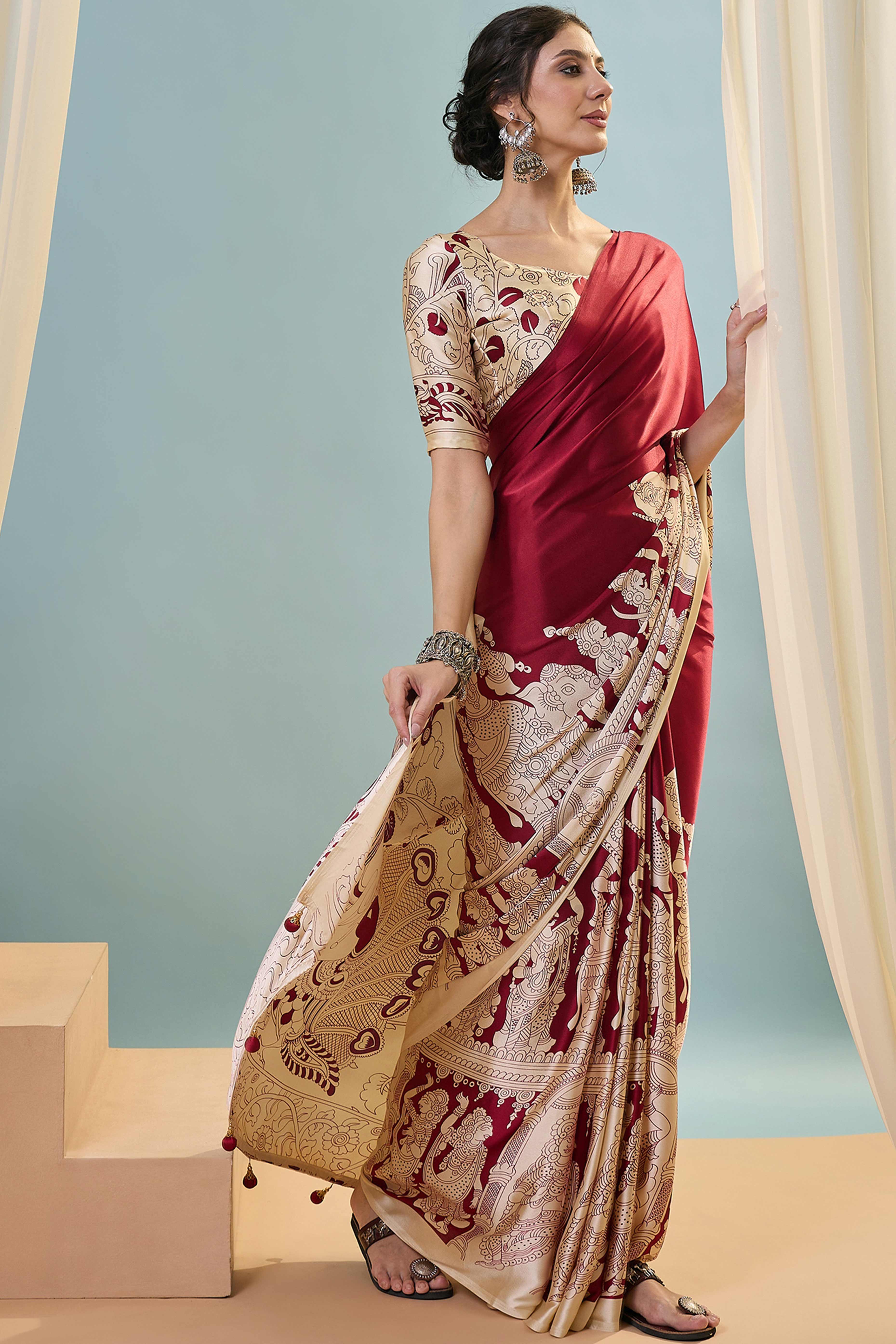 Red Kalamkari Style Modal Satin Saree Featuring Intricate Artistic Prints
