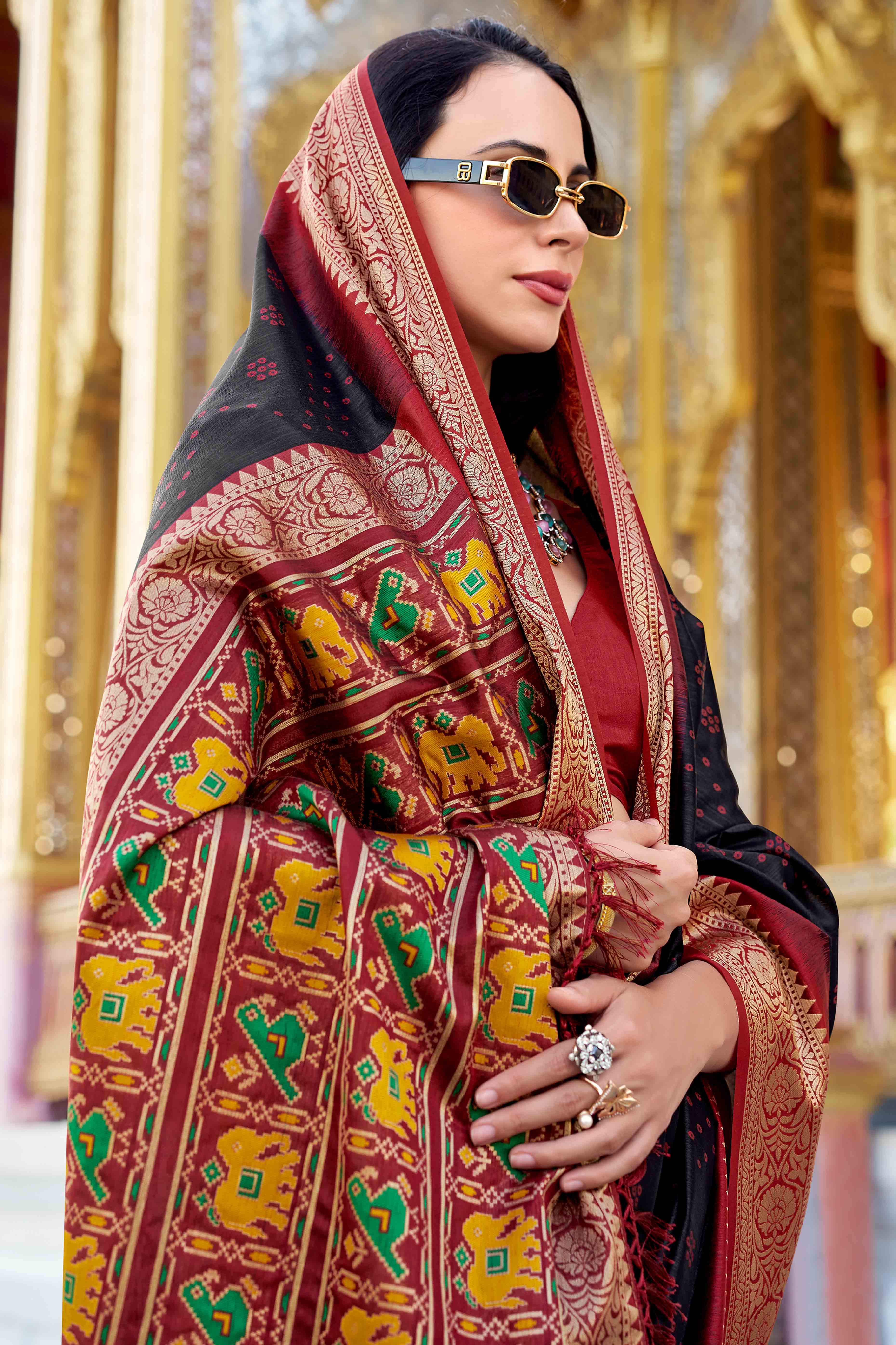 Silk Blend Woven Bandhani Saree In Black With Contrasting Patola Pallu