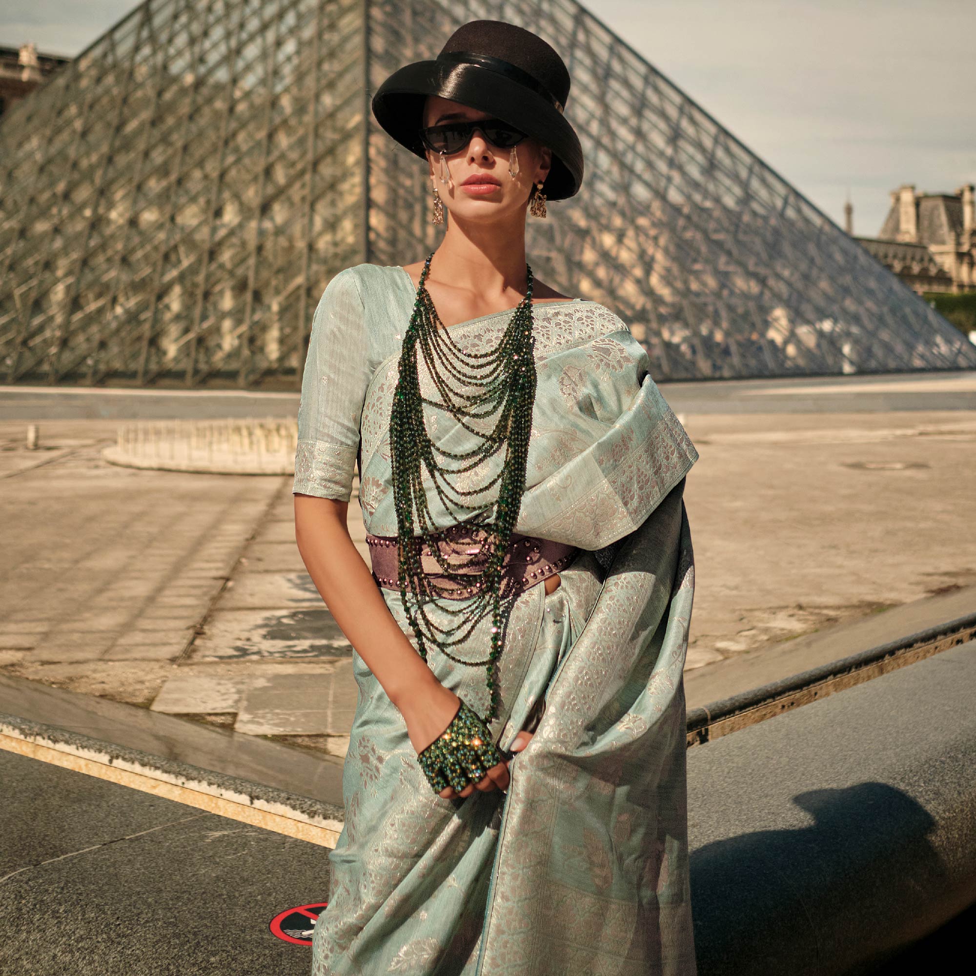 Turquoise Green Floral Woven Art Silk Saree With Tassels