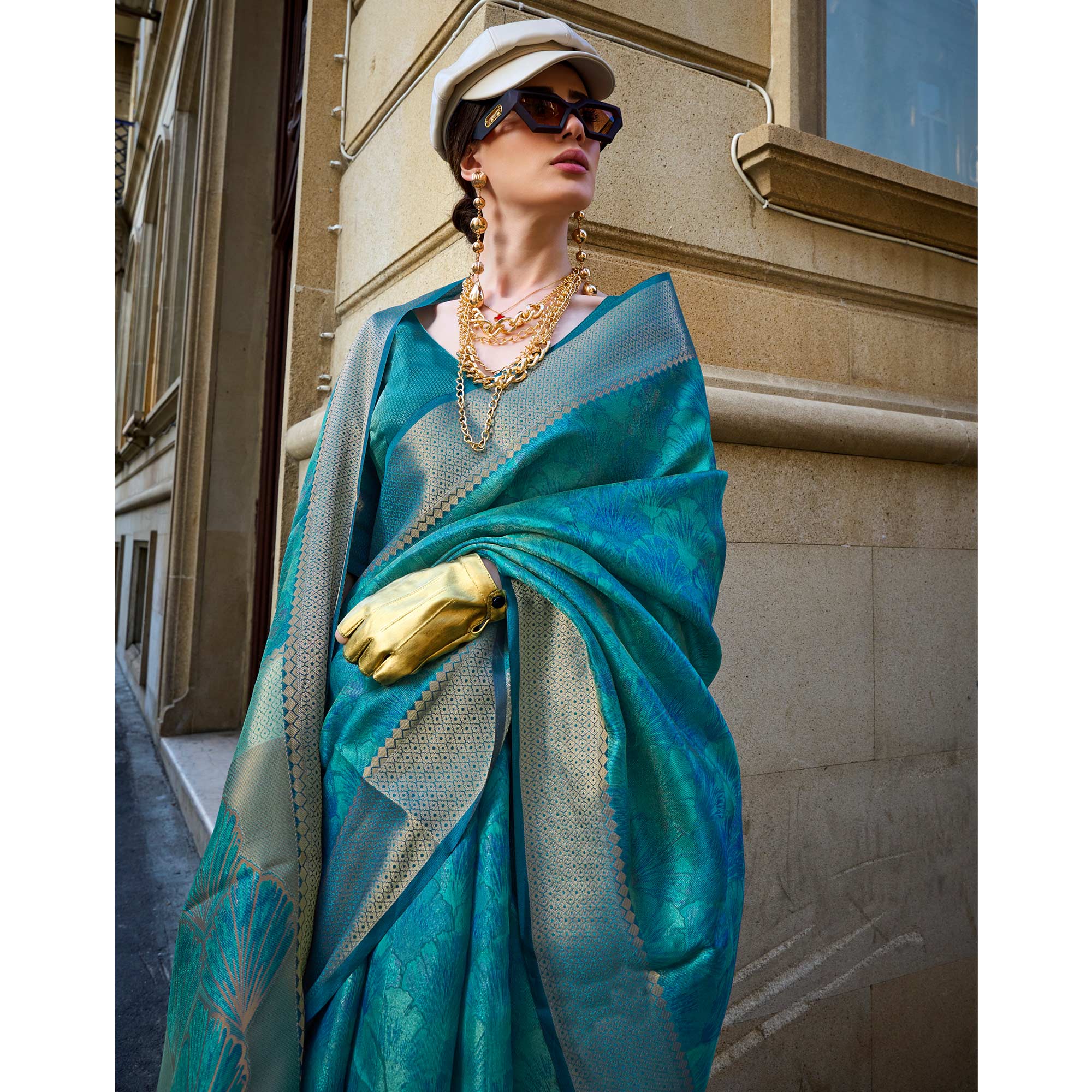 Teal Zari Woven Organza Saree Tassels