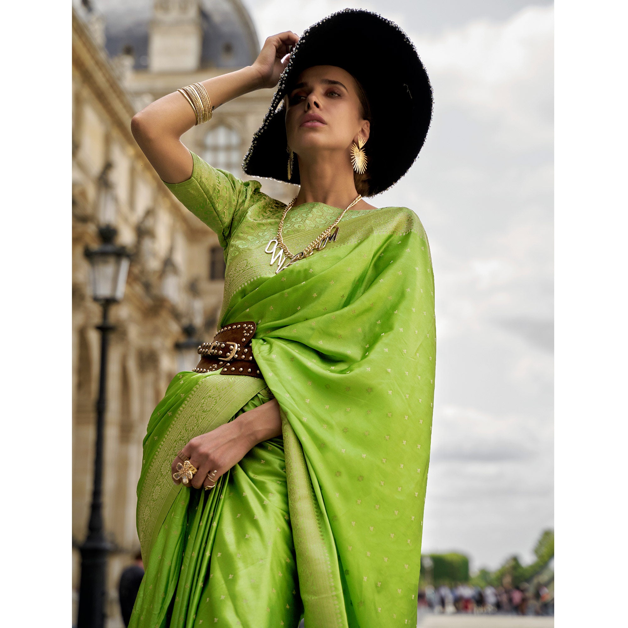 Green Zari Woven Satin Saree With Tassels