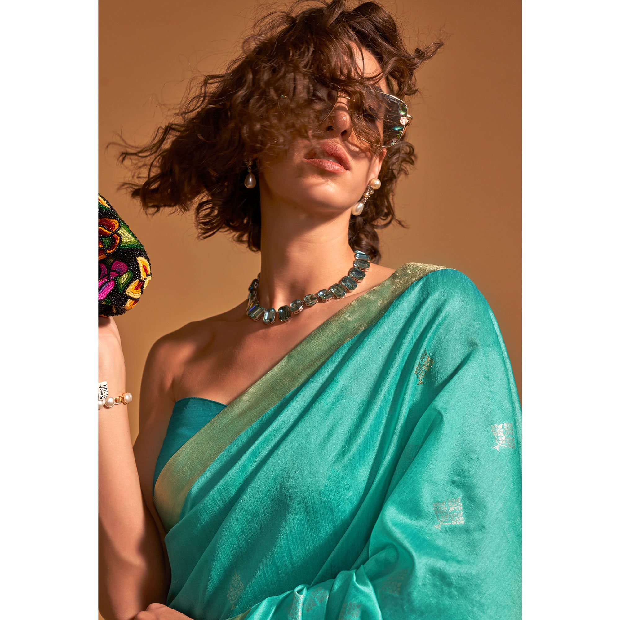 Turquoise Woven Art Silk Saree With Tassels