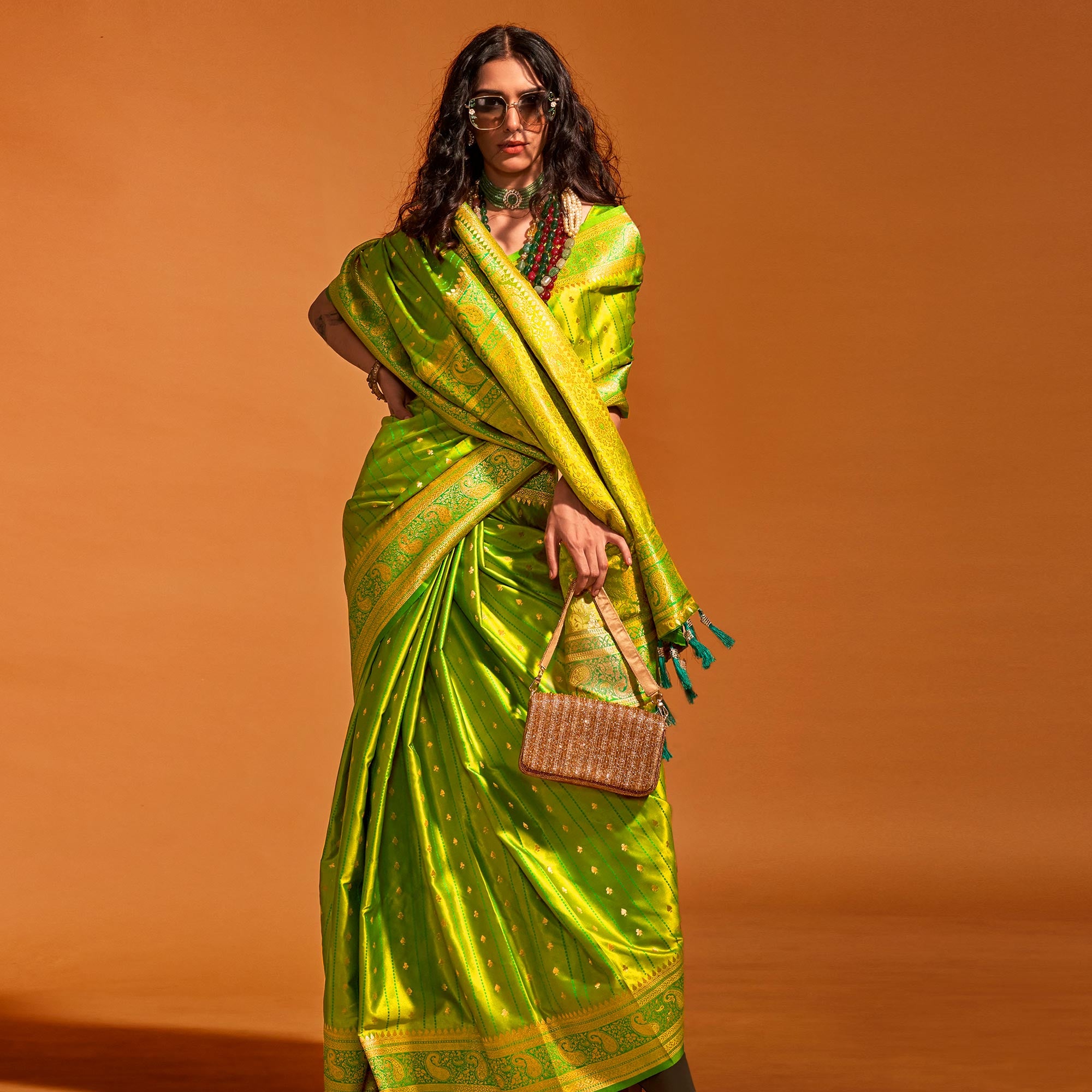 Green Woven Zari Border Satin Saree With Tassels