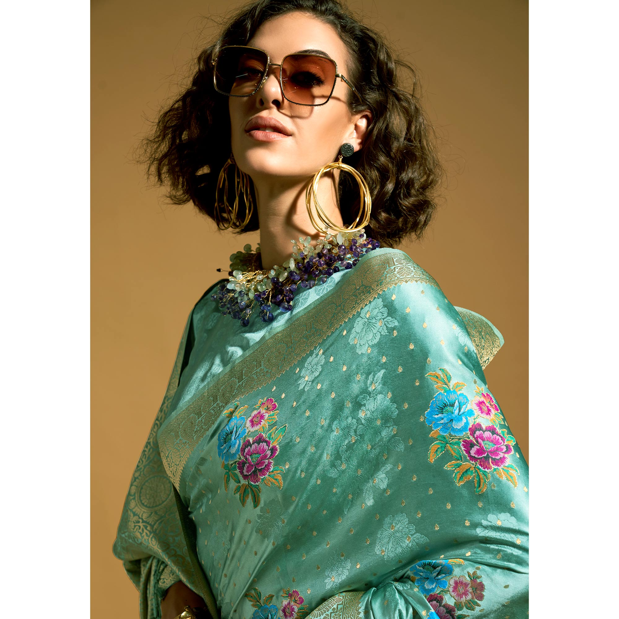 Light Turquoise Floral Woven Satin Saree With Tassels