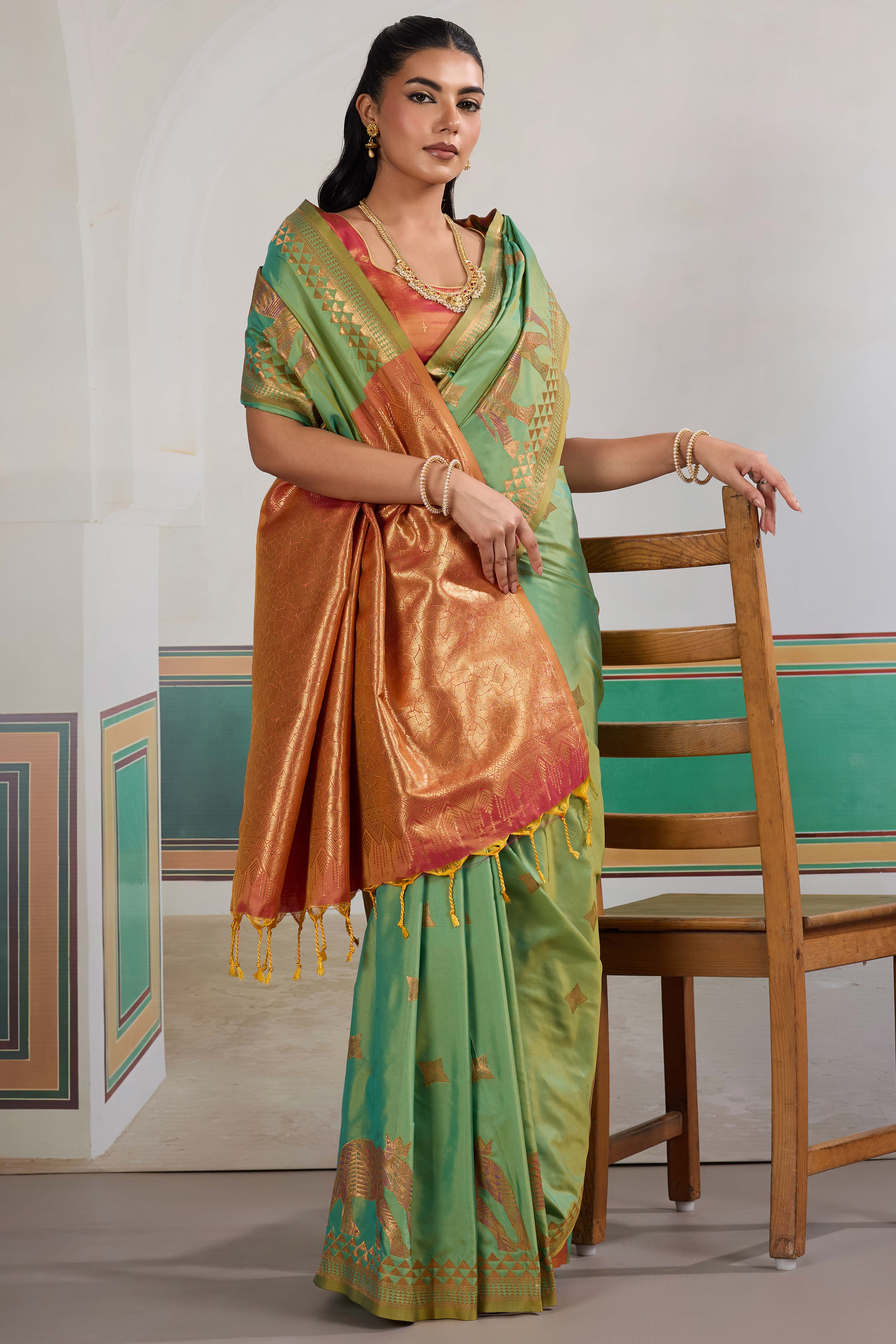 Traditional Green Pure Silk Saree Featuring Elephant Motif Zari Weaving & Tassel Pallu