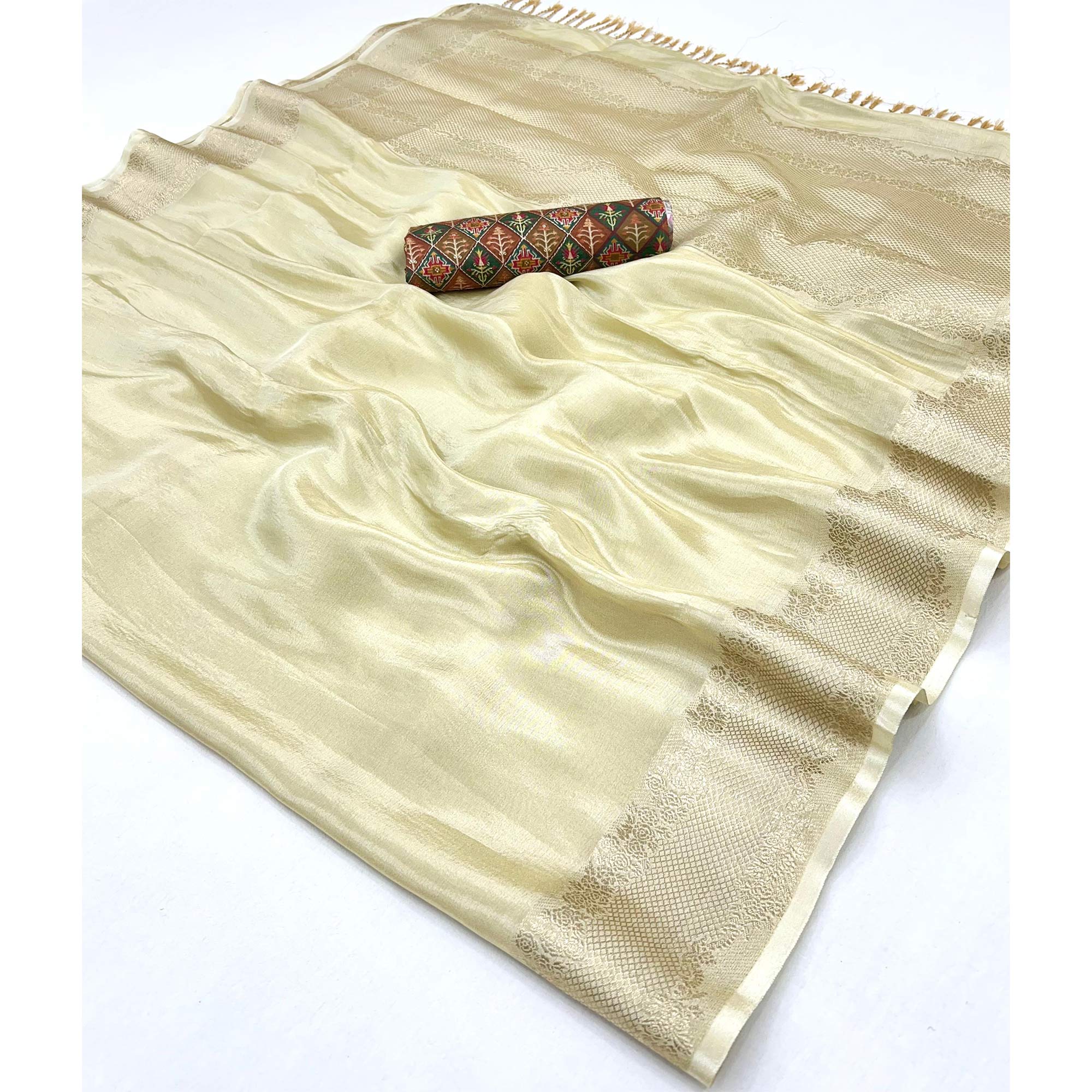 Cream Tissue Saree Adorned with Zari Weaving Border