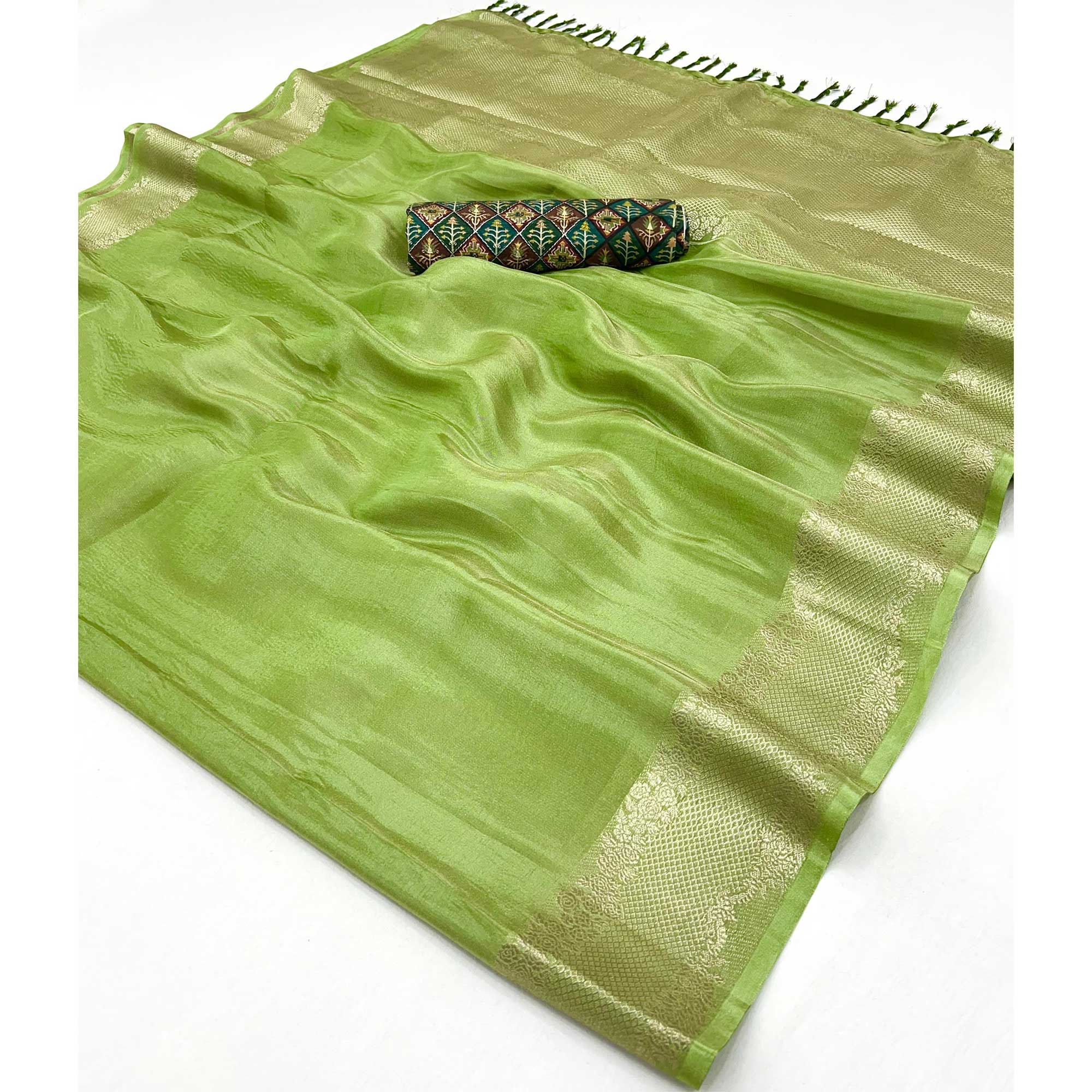 Green Tissue Saree Adorned with Zari Weaving Border