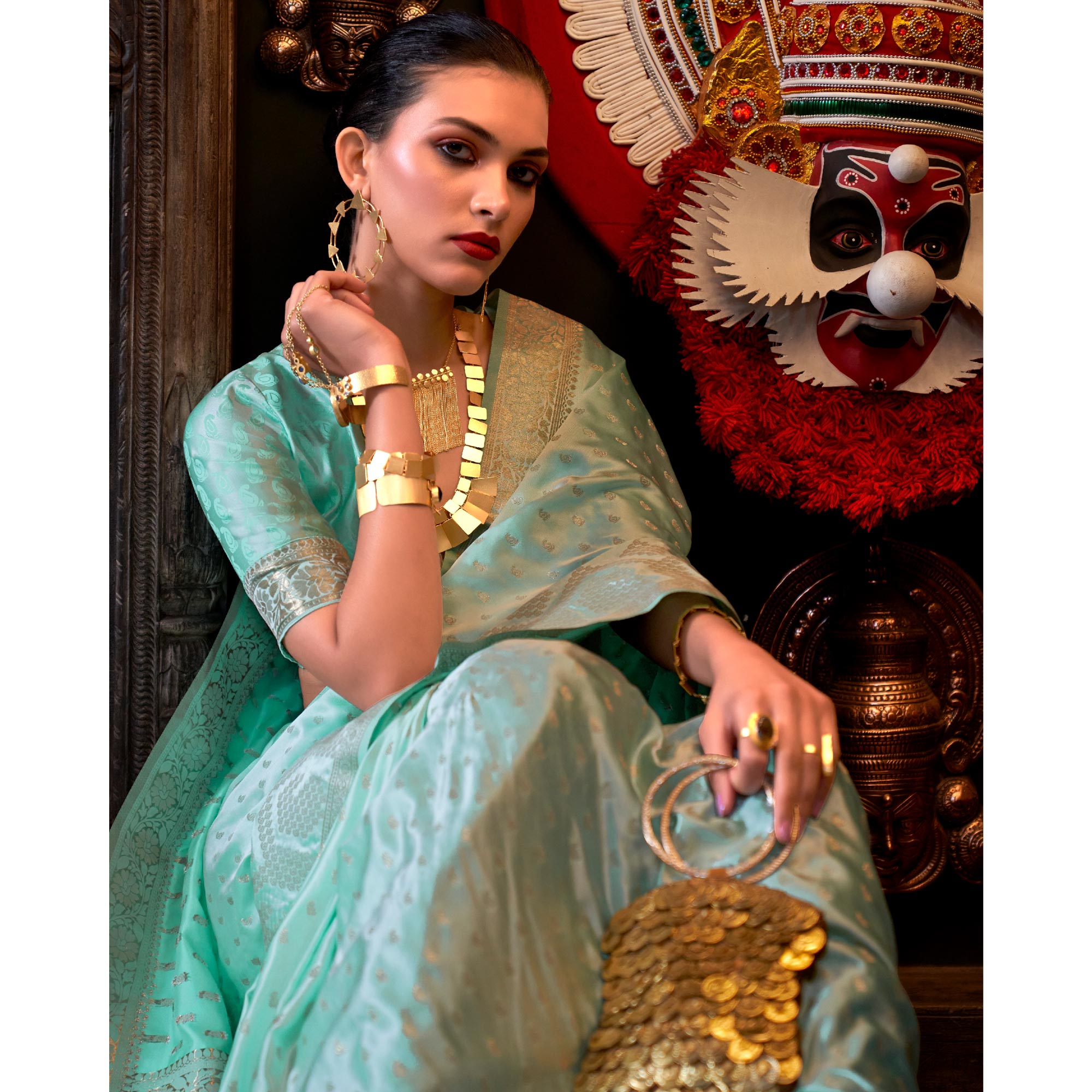Sea Green Woven Satin Saree With Tassels