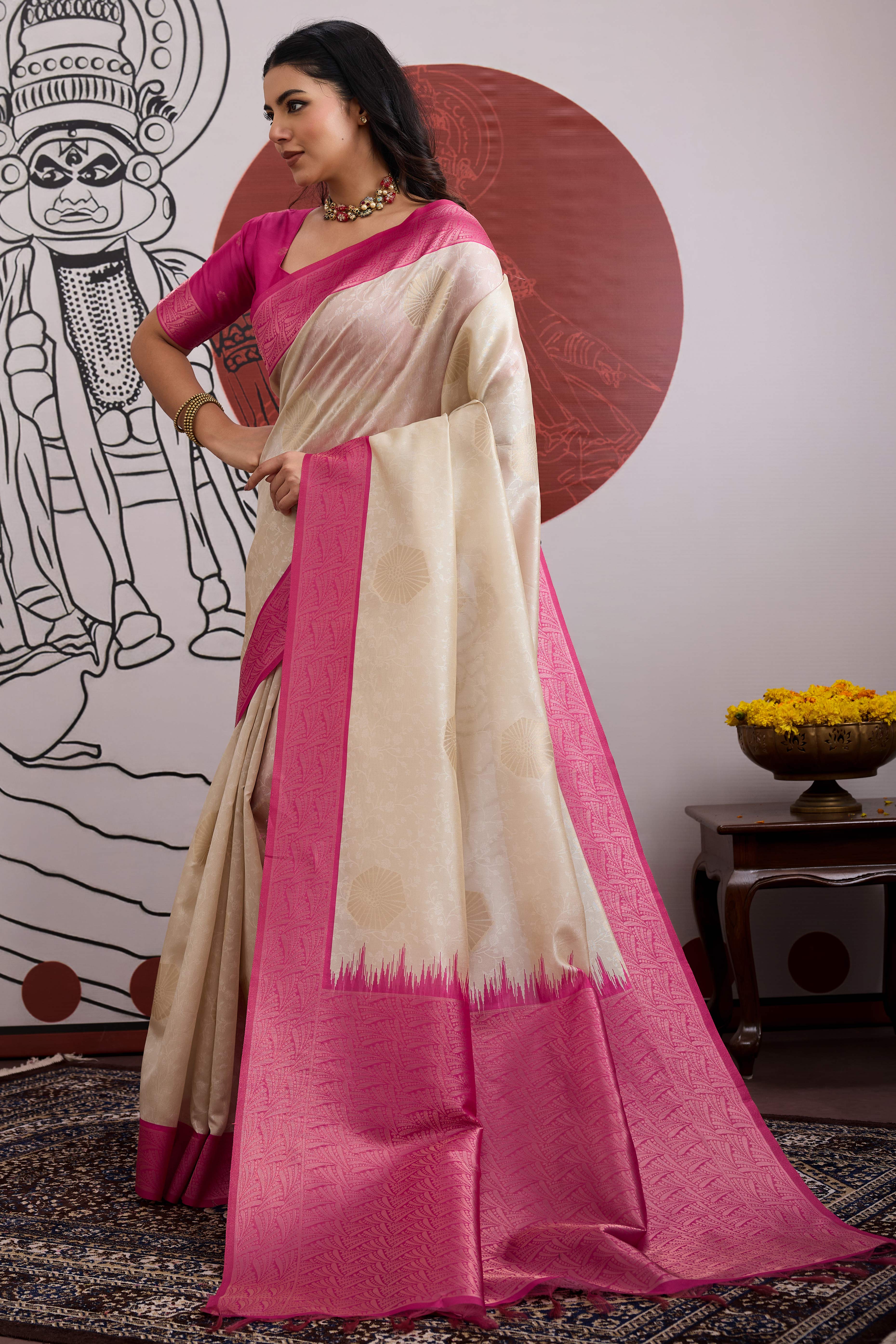 Graceful Cream & Pink Zari Weaving Silk Saree Highlighted By Decorative Tassel Pallu