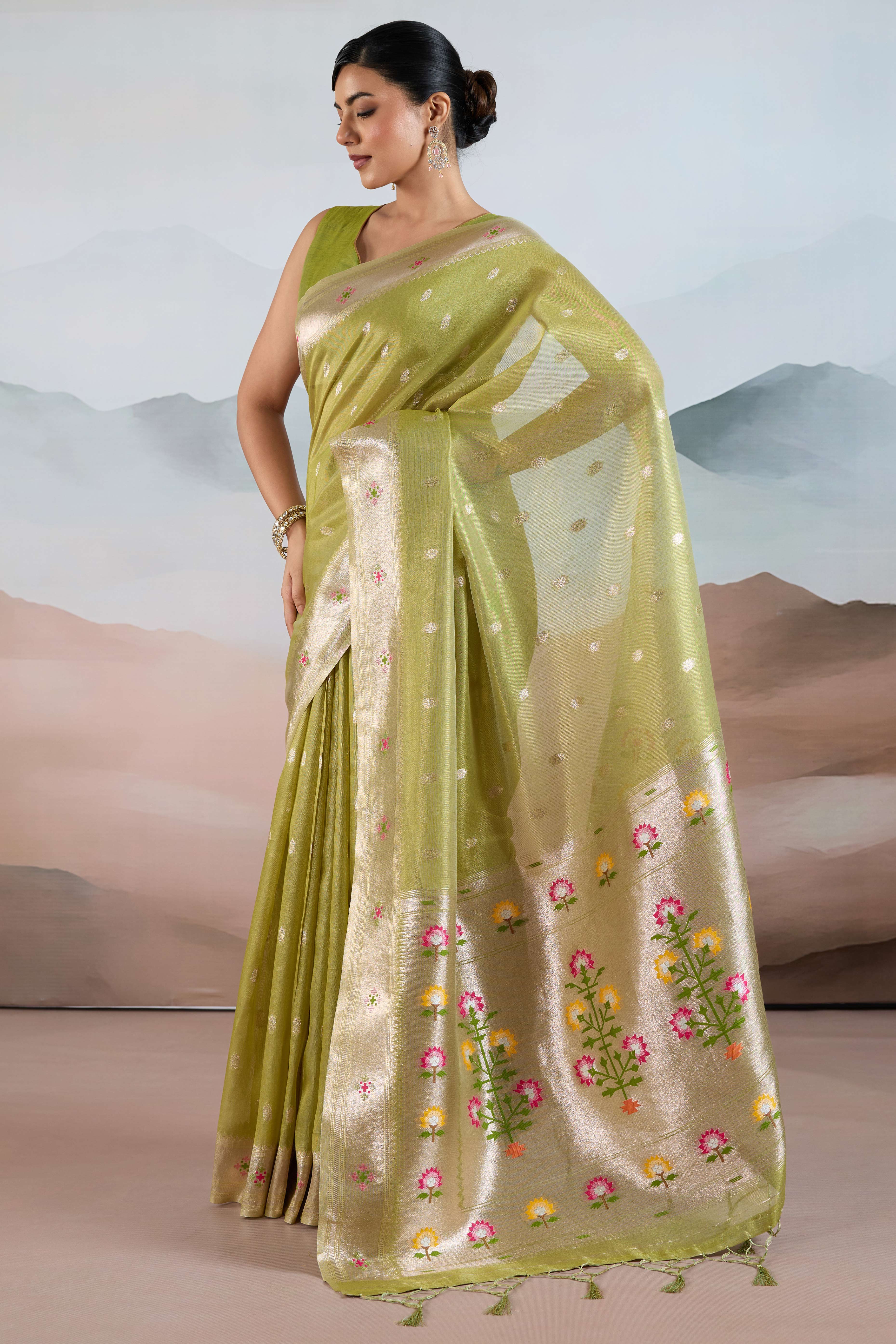 Green Festive Tissue Saree Crafted with Artistic Zari Butti Weaving and a Featherlight Texture