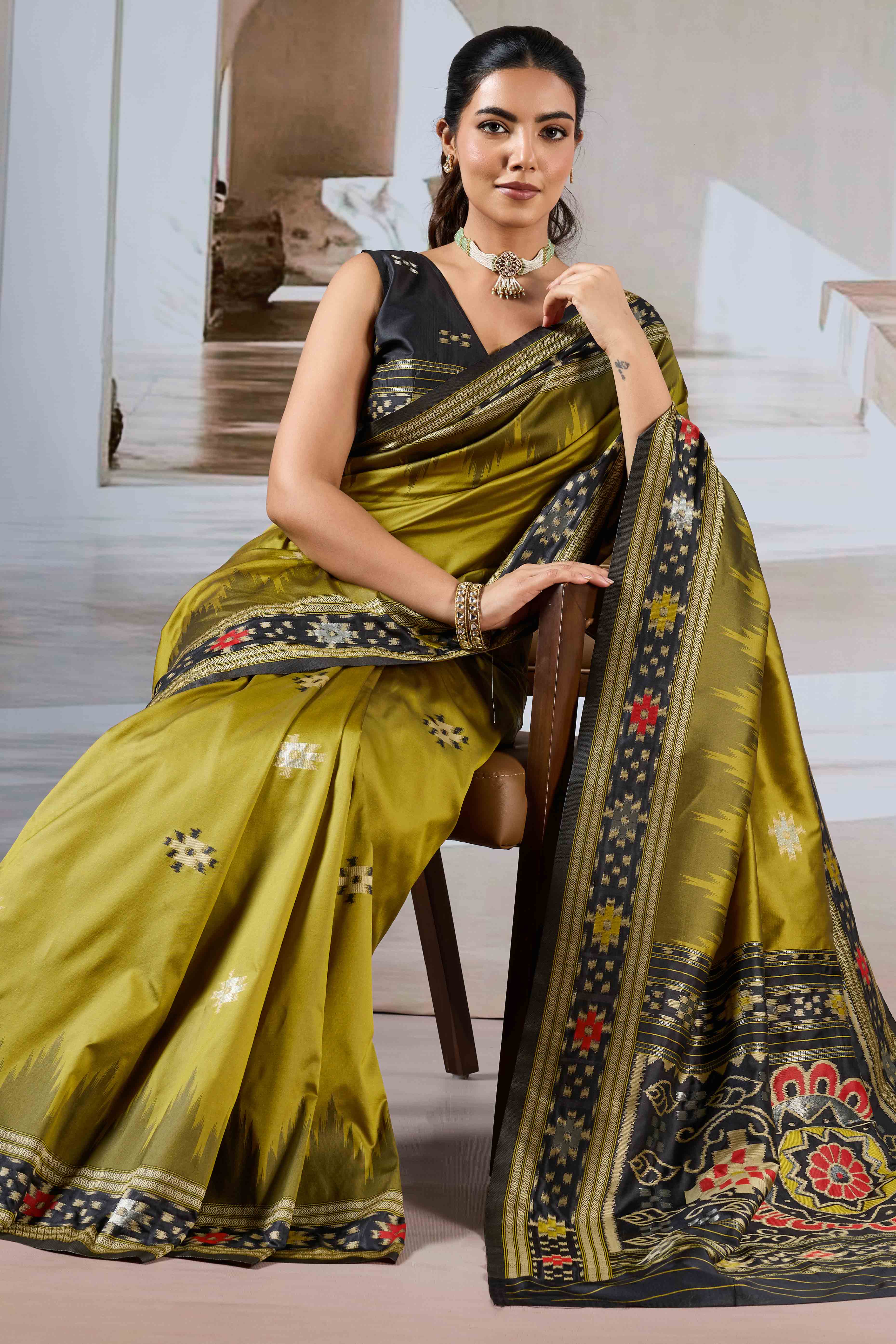 Olive Art Silk Saree Adorned with Intricate Patola Style Woven Designs