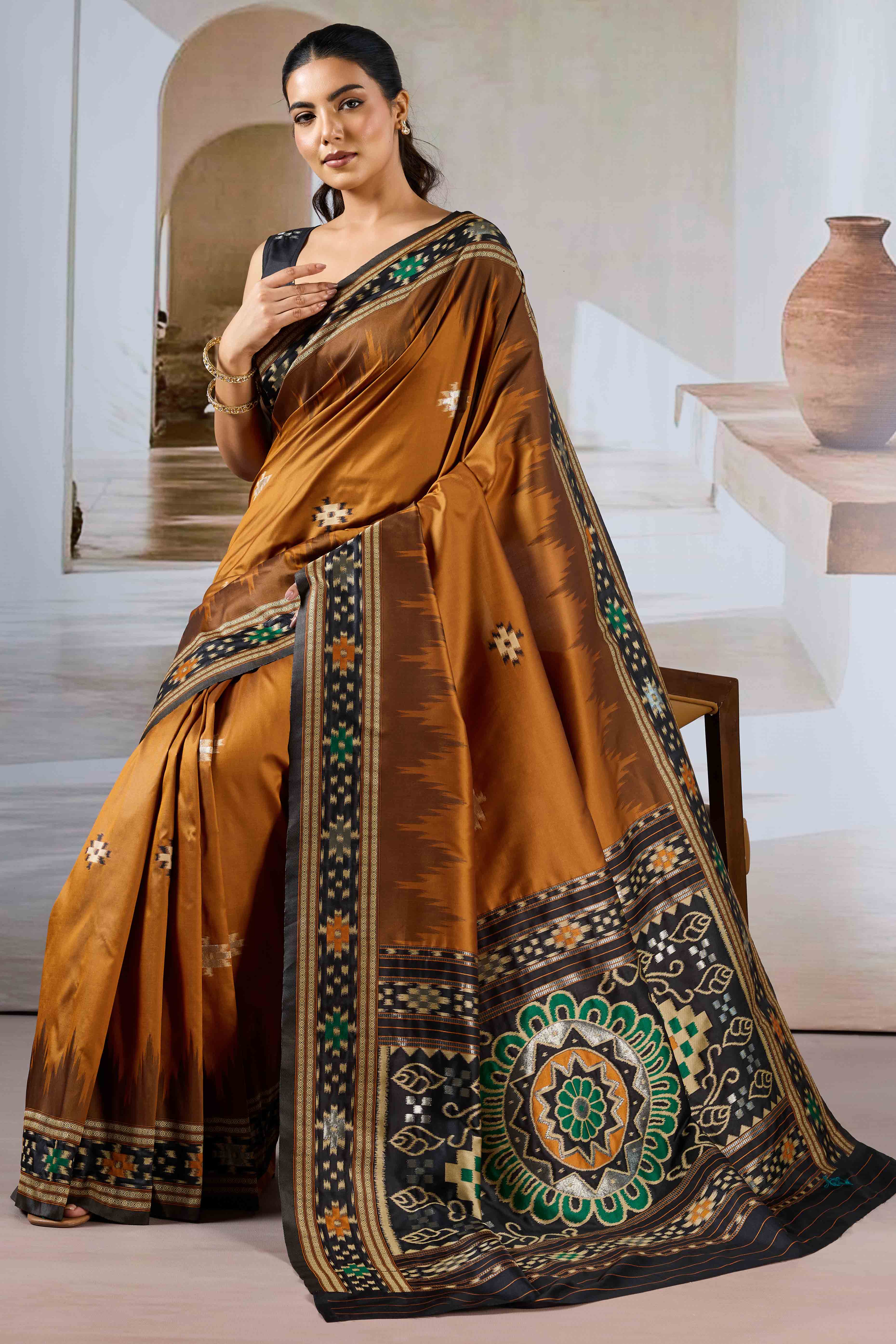Brown Art Silk Saree Adorned with Intricate Patola Style Woven Designs