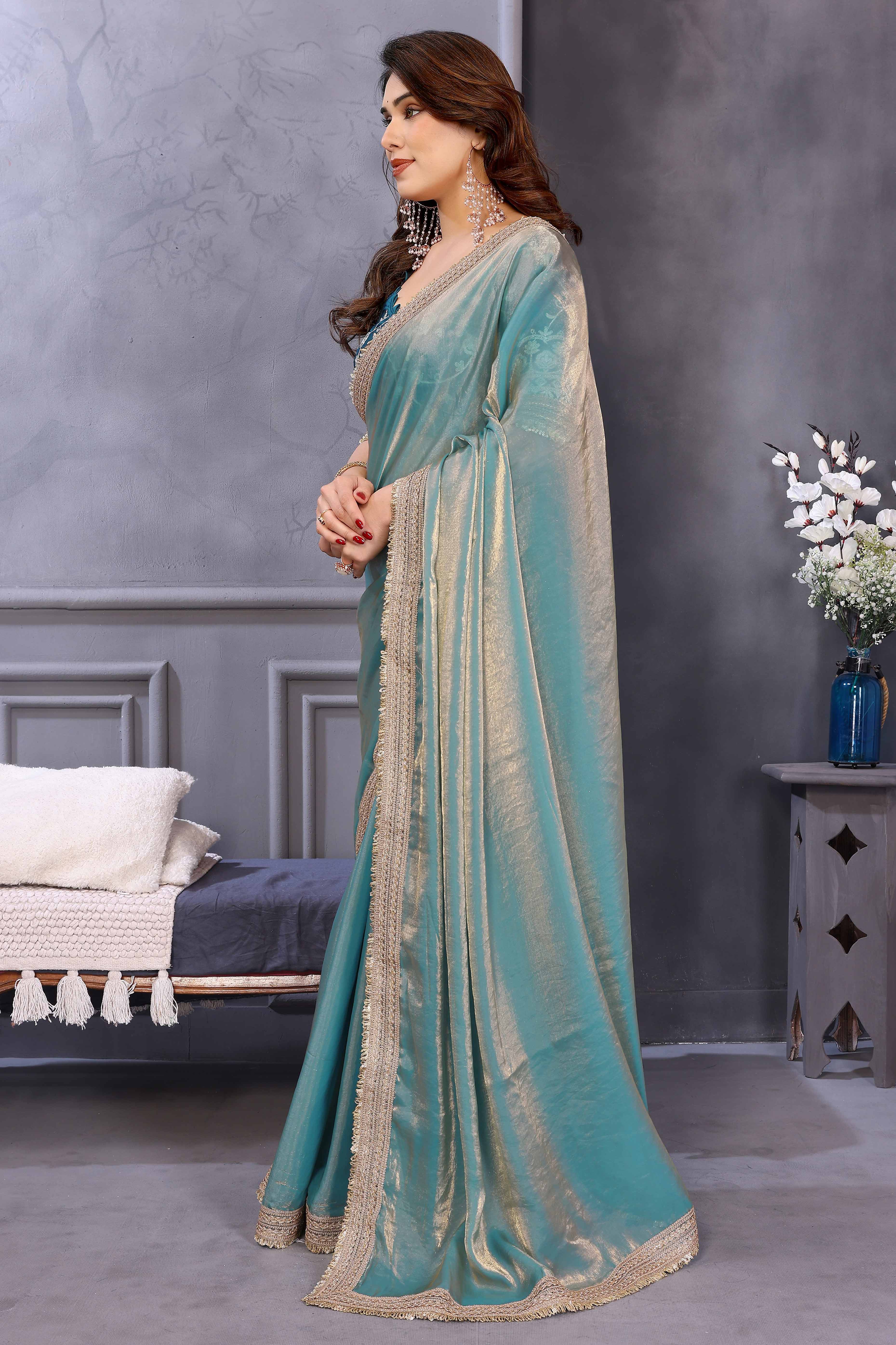 Teal Satin Saree with Solid Body and Decorative Lace Embellished Border – A Modern Ethnic Staple