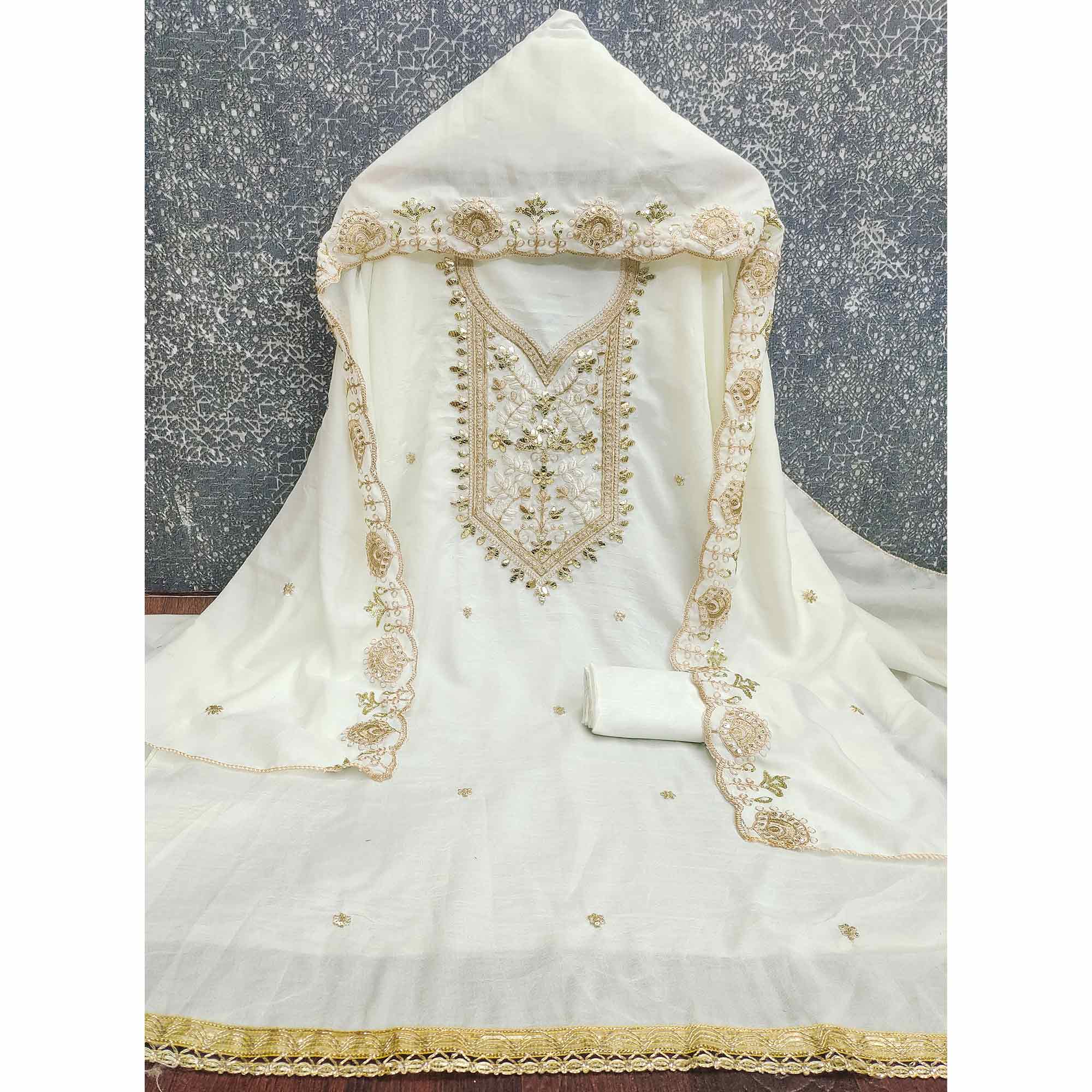 Timeless Offwhite Floral Embroidered Vichitra Silk Dress Material Highlighted With Gota Patti Work