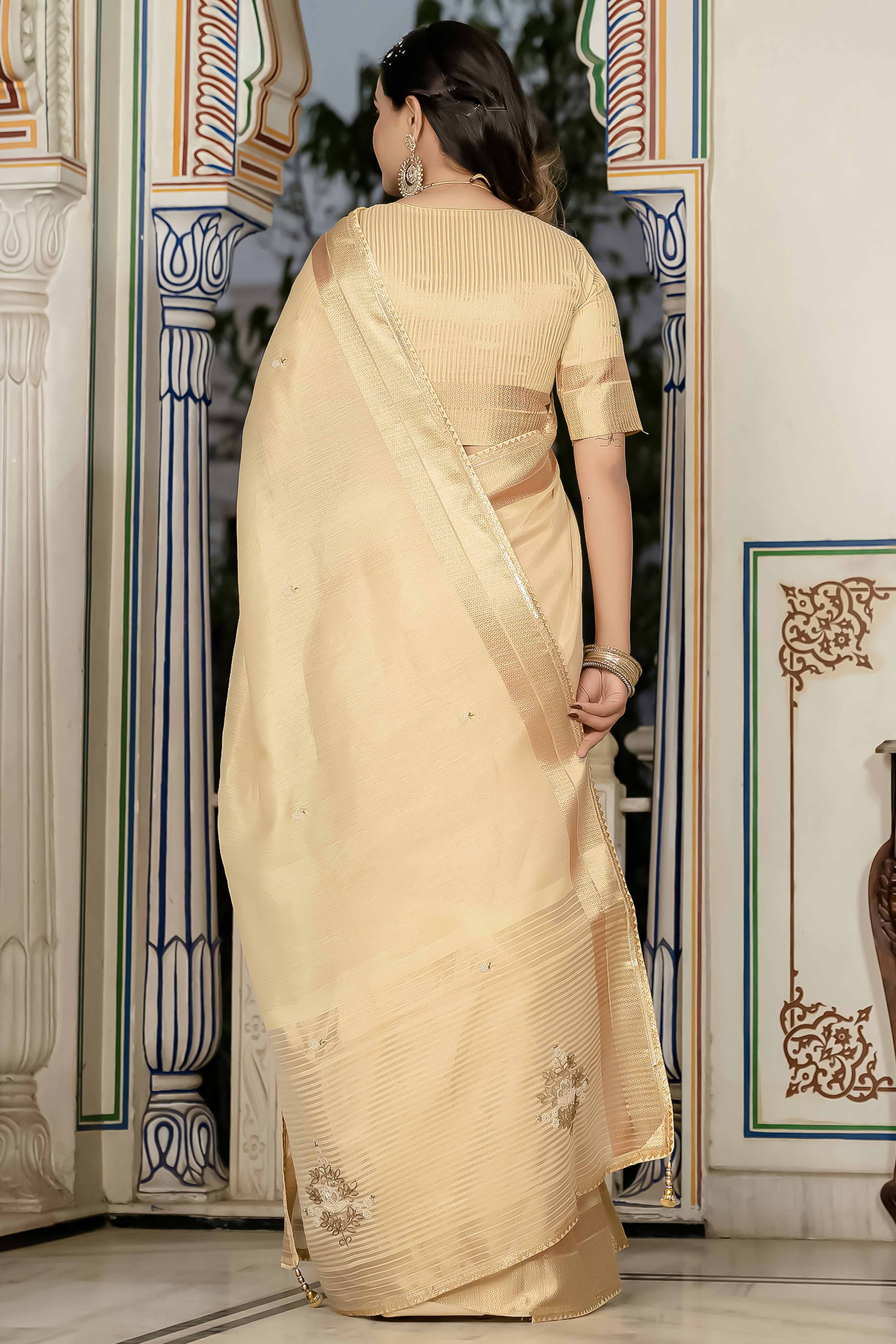 Beige Tissue Linen Saree Featuring Intricate Zari and Beadwork