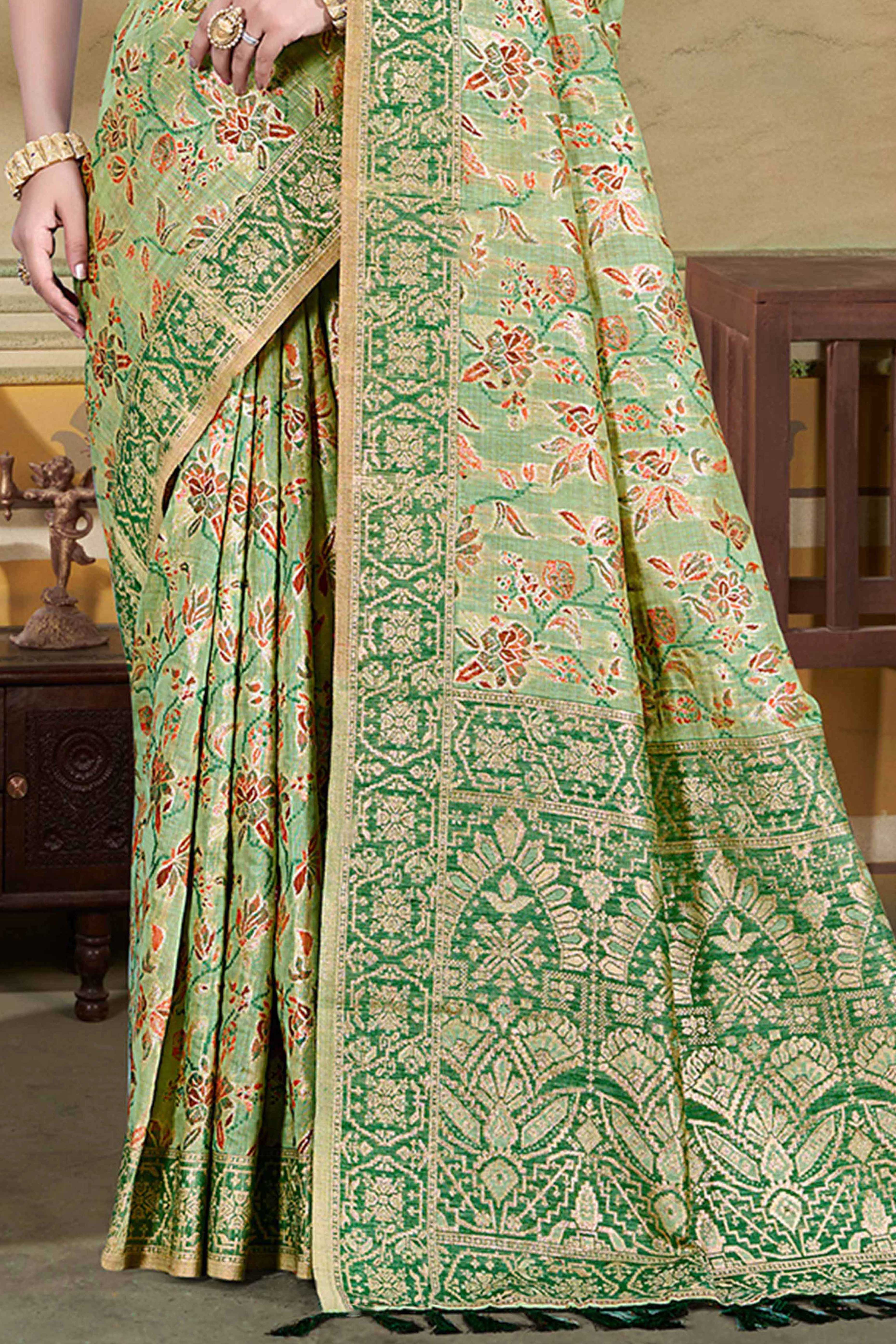 Alluring Green Floral Zari Weaving Cotton Silk Saree With Graceful Tassel Pallu