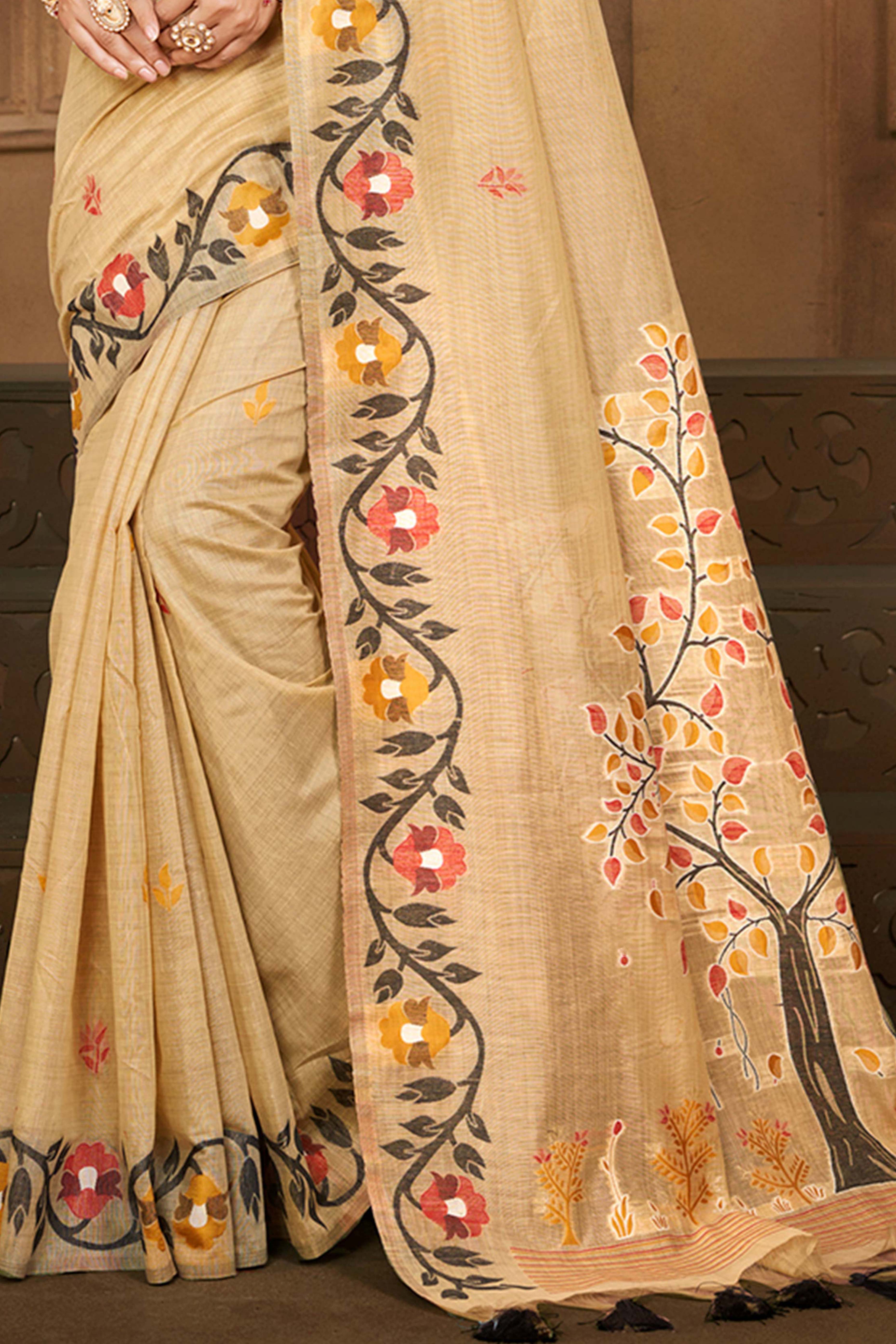 Charming Chikoo Floral Weaving Cotton Silk Saree Enhanced With Tree Motif Pallu With Tassel