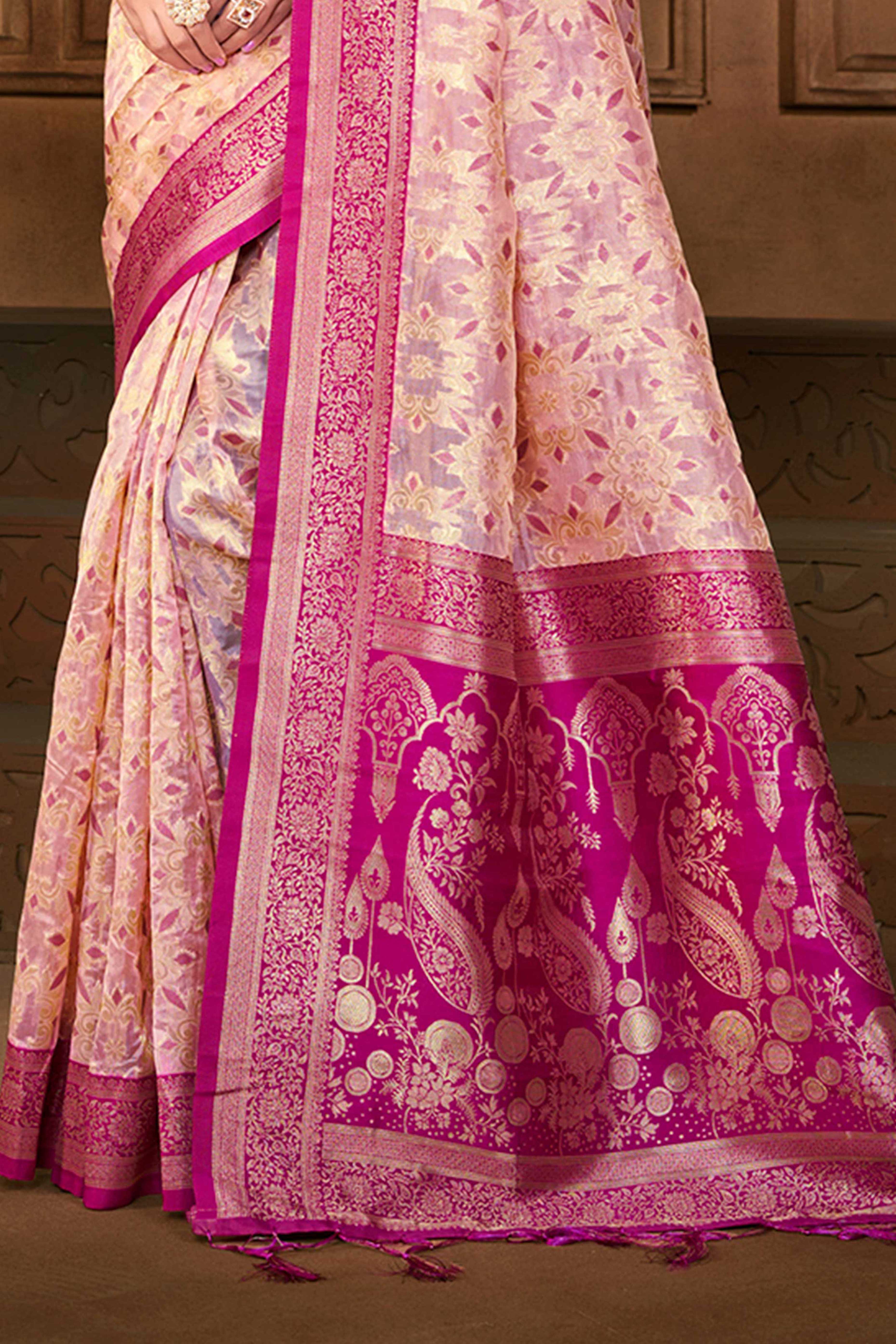 Stunning Pastel Magenta Floral Weaving Silk Blend Saree Enhanced With A Stylish Tassel Pallu