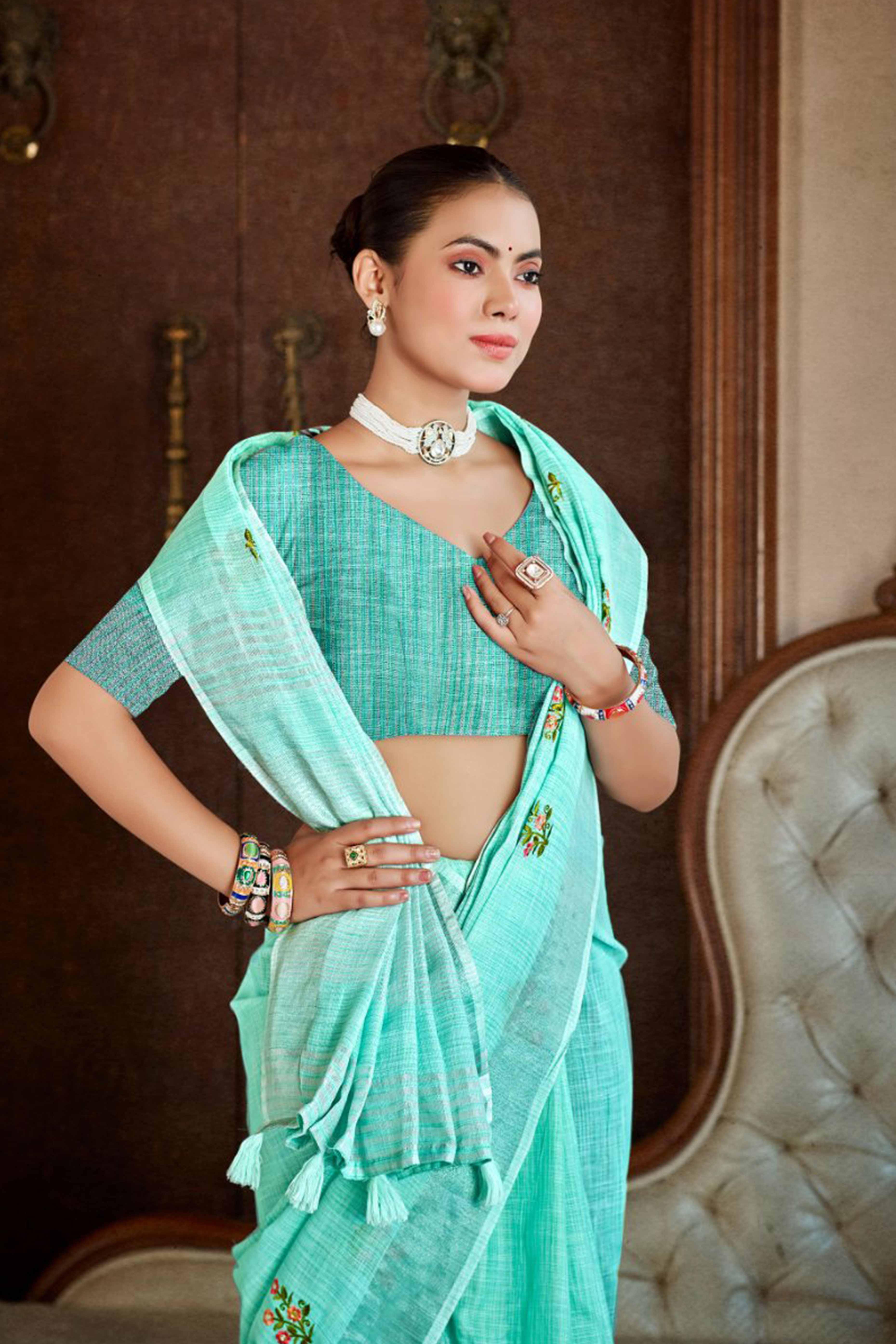 Turquoise Embroidered Linen Saree with Floral Motifs in Woven Fabric