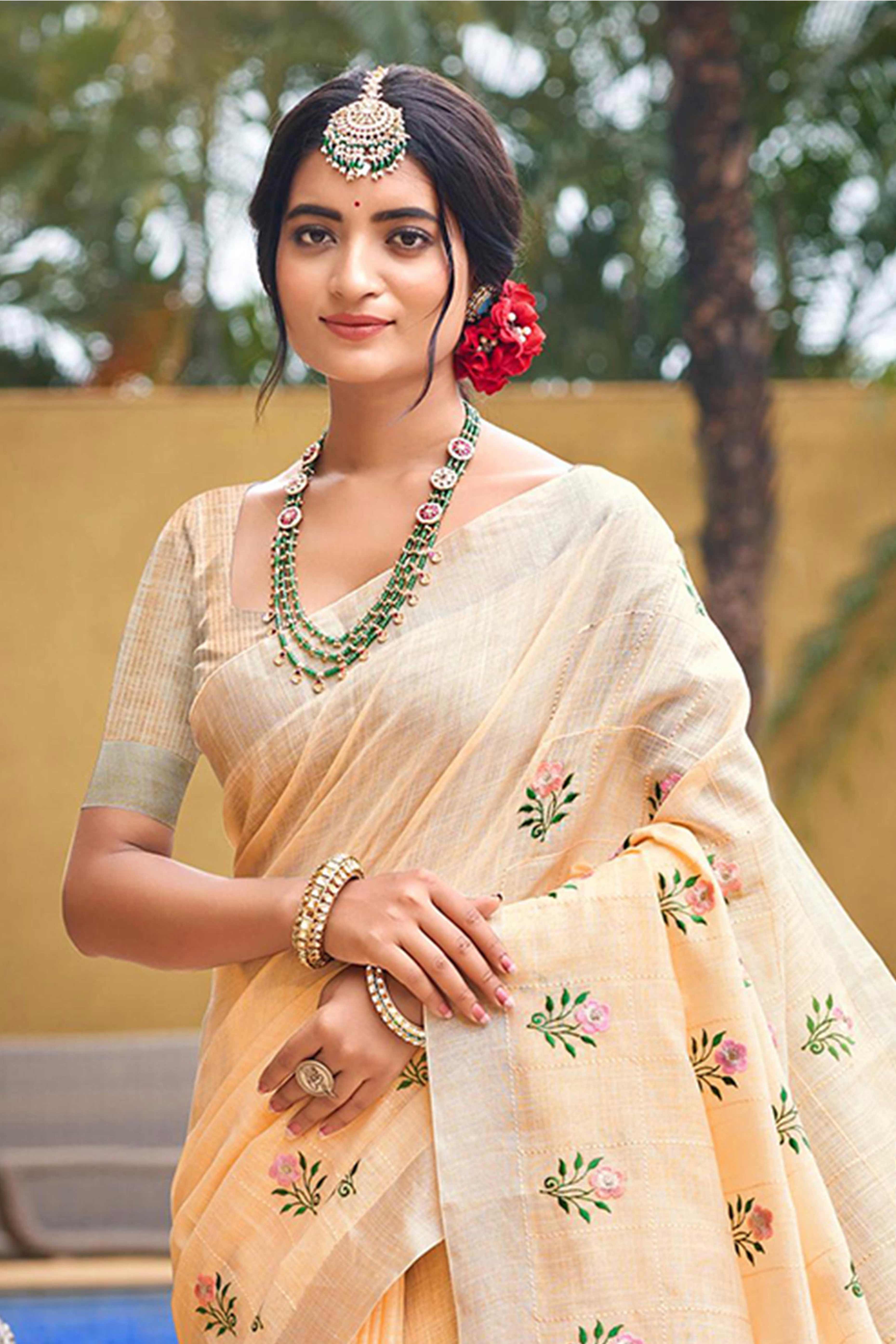 Captivating Light Peach Floral Thread Embroidered Linen Saree With Elegant Weaving Border