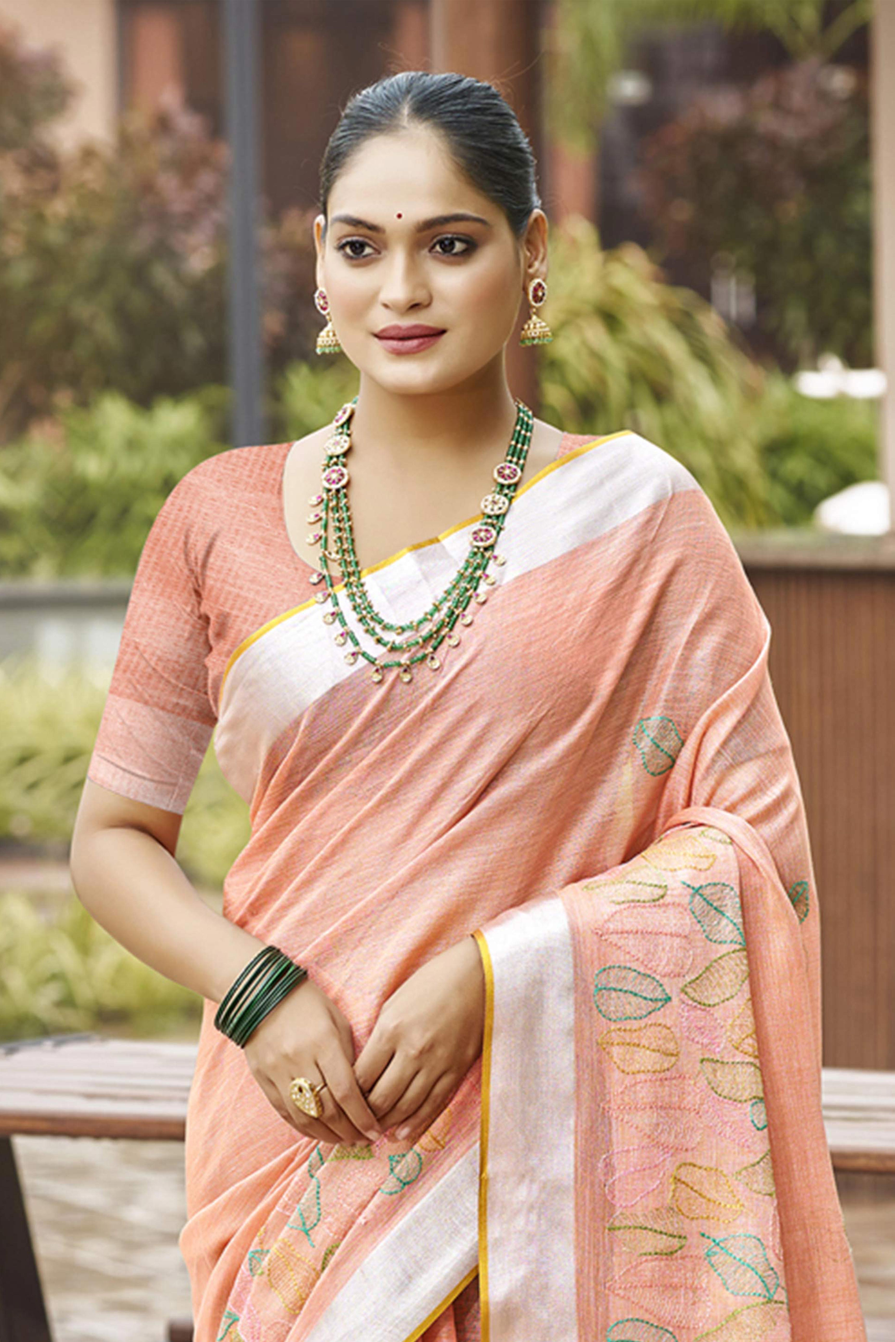 Classic Peach Leaf Pattern Thread Embroidery Work Linen Saree With Tassel Pallu