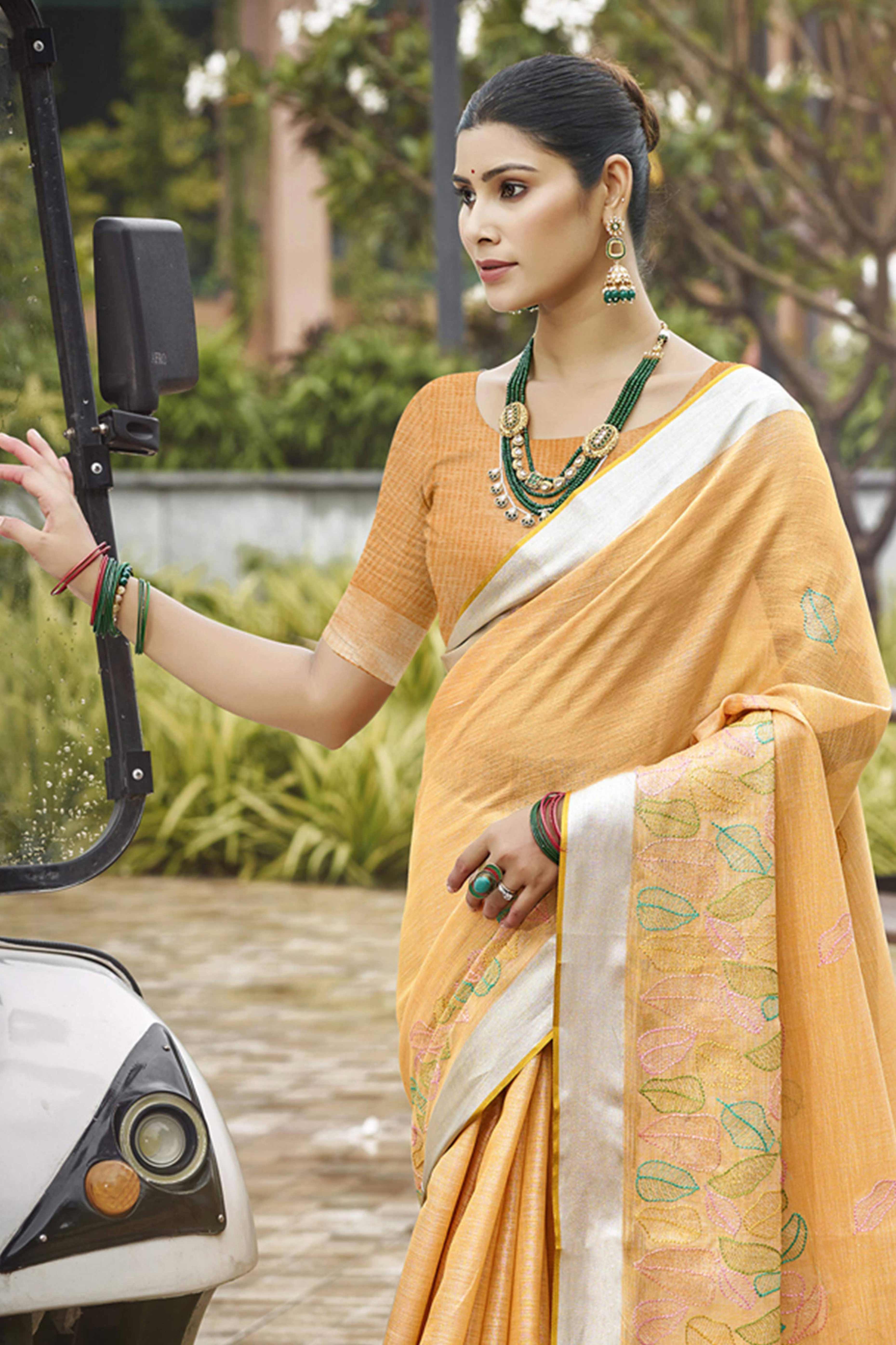 Classic Light Orange Leaf Pattern Thread Embroidery Work Linen Saree With Tassel Pallu