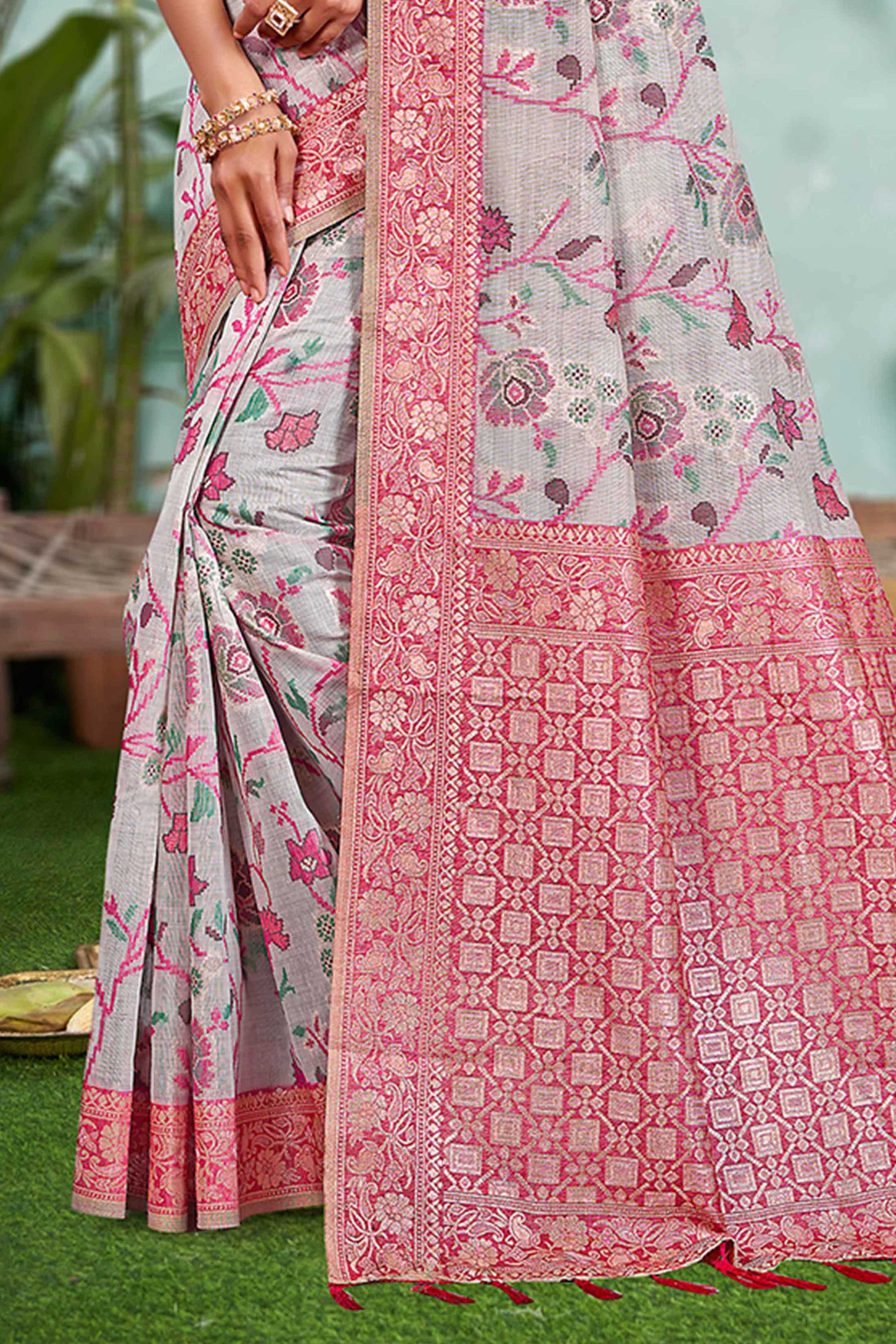 Captivating Grey Floral Zari Weaving Cotton Silk Saree Accented With Tassel Pallu