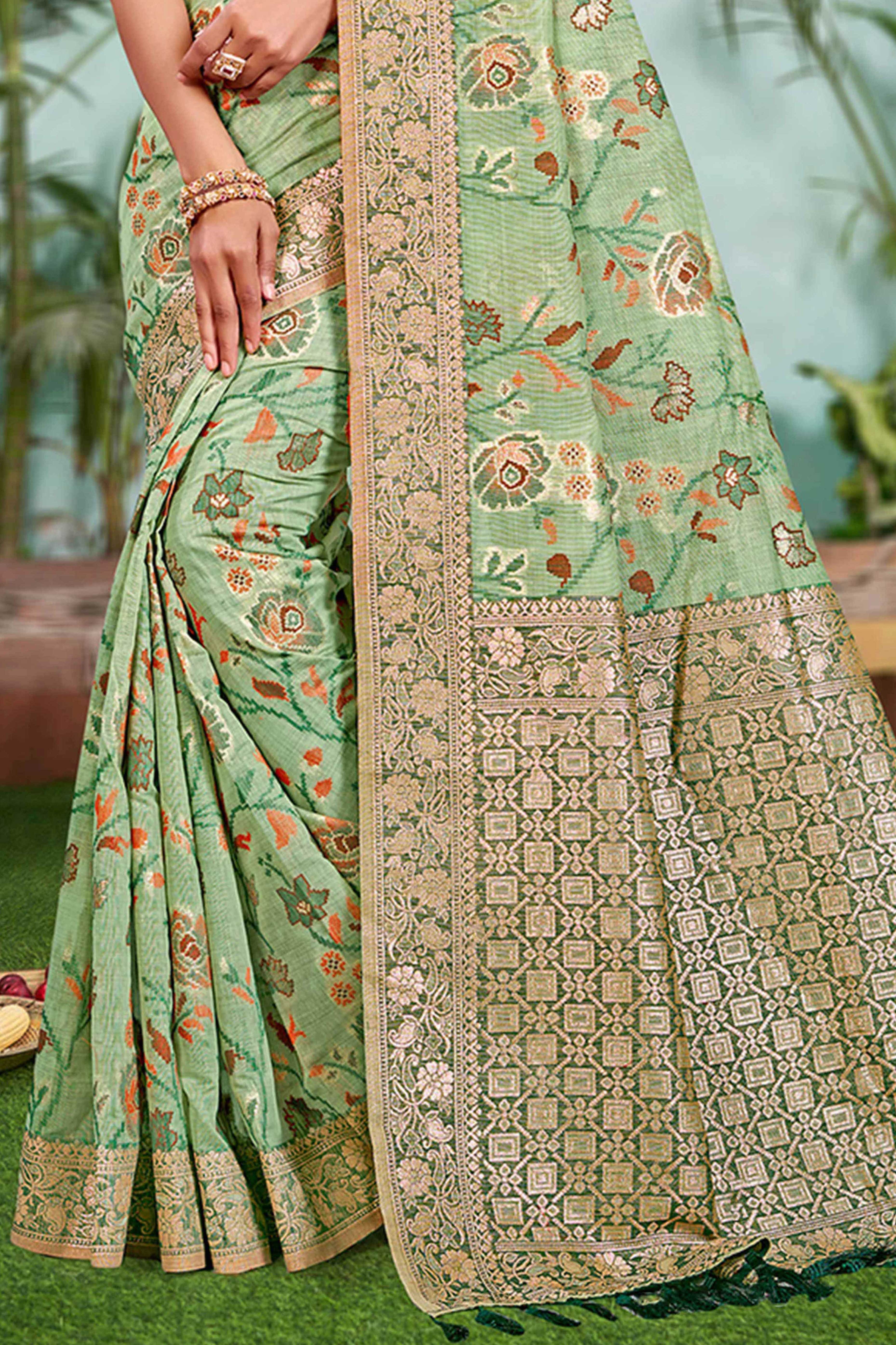 Captivating Green Floral Zari Weaving Cotton Silk Saree Accented With Tassel Pallu