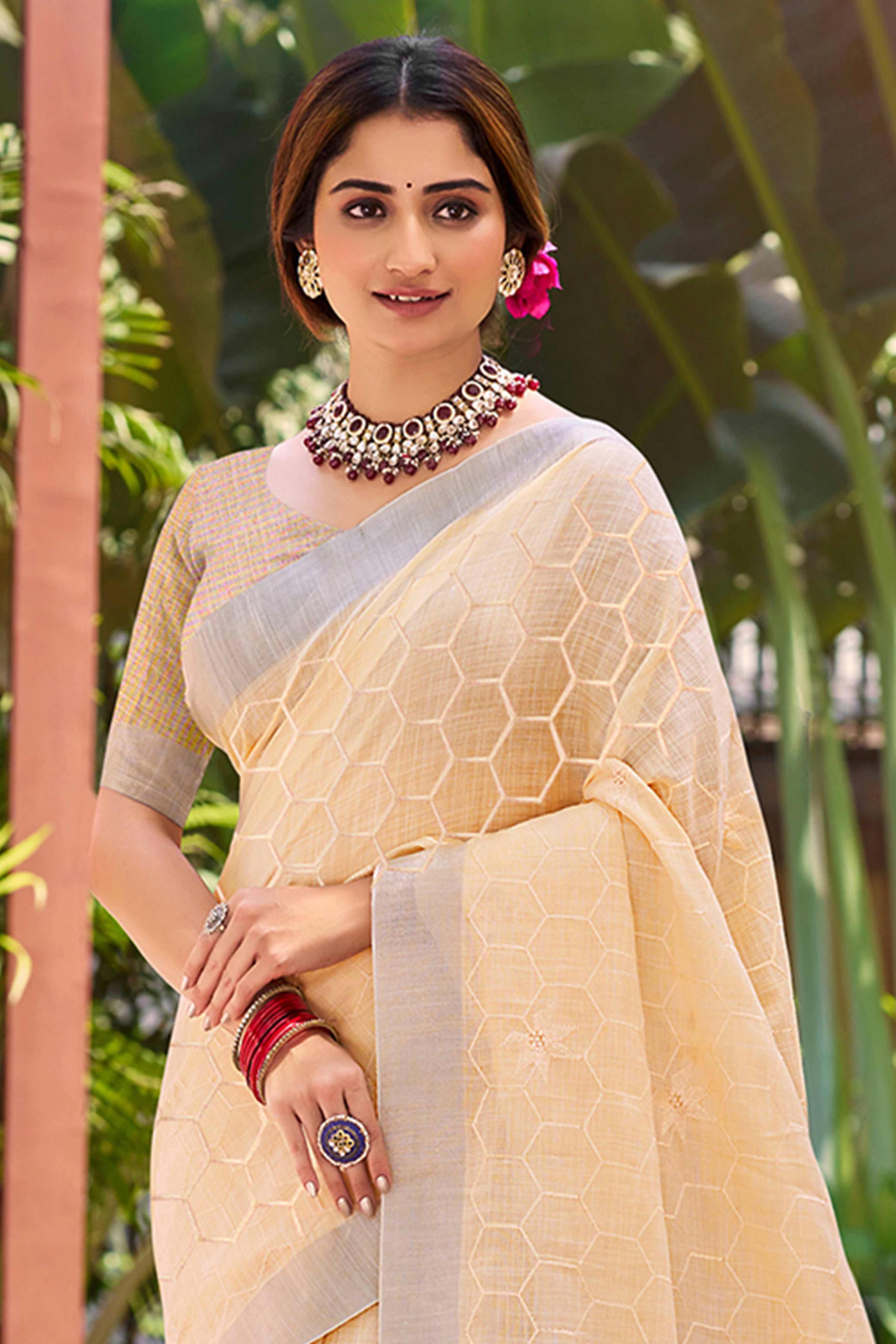 Light Peach Classic Linen Saree Enhanced With Fine Geometric Embroidery Work & Tassel Pallu