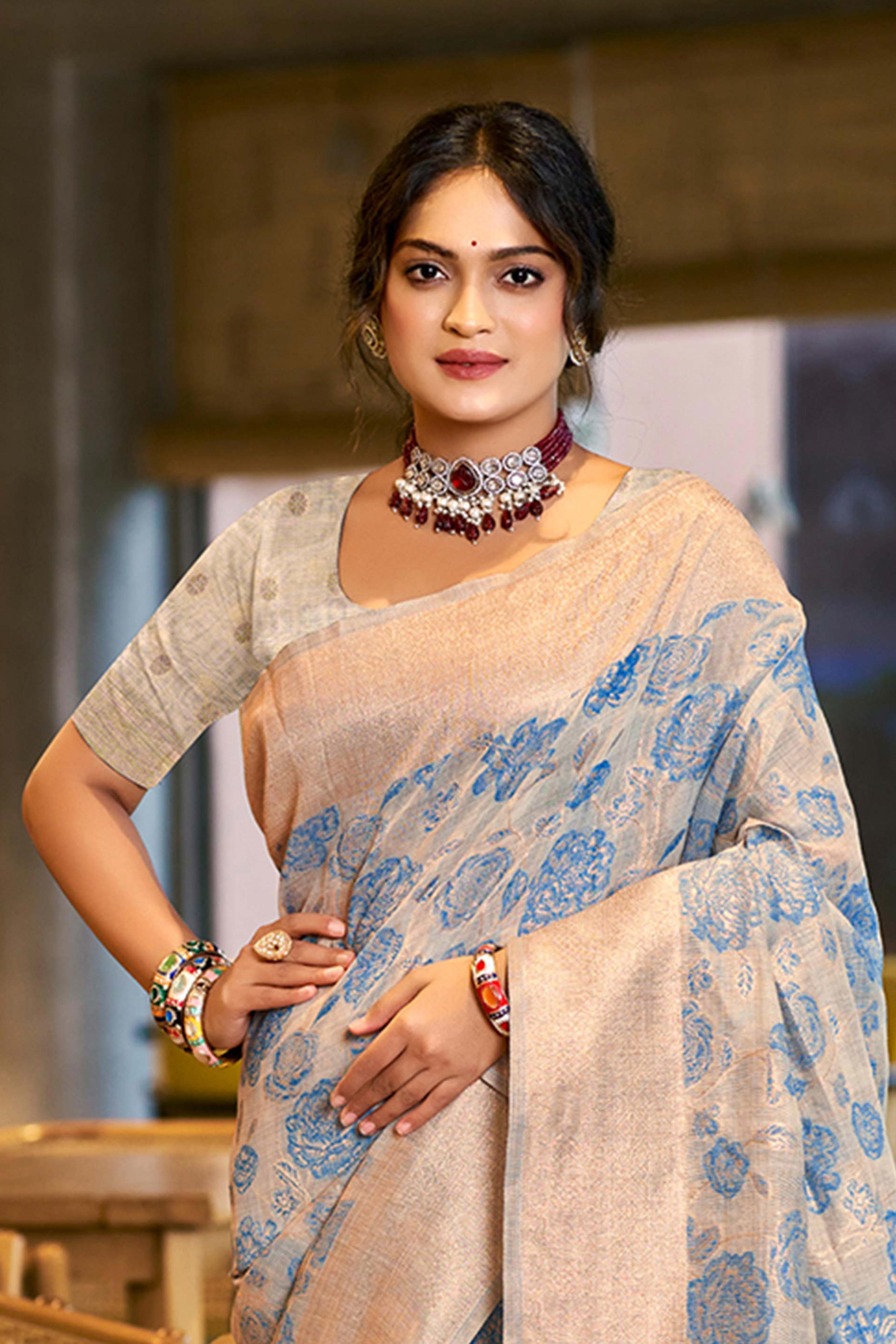 Blue Premium Cotton Silk Saree Highlighted With Floral Weaving Work & Tassel Pallu