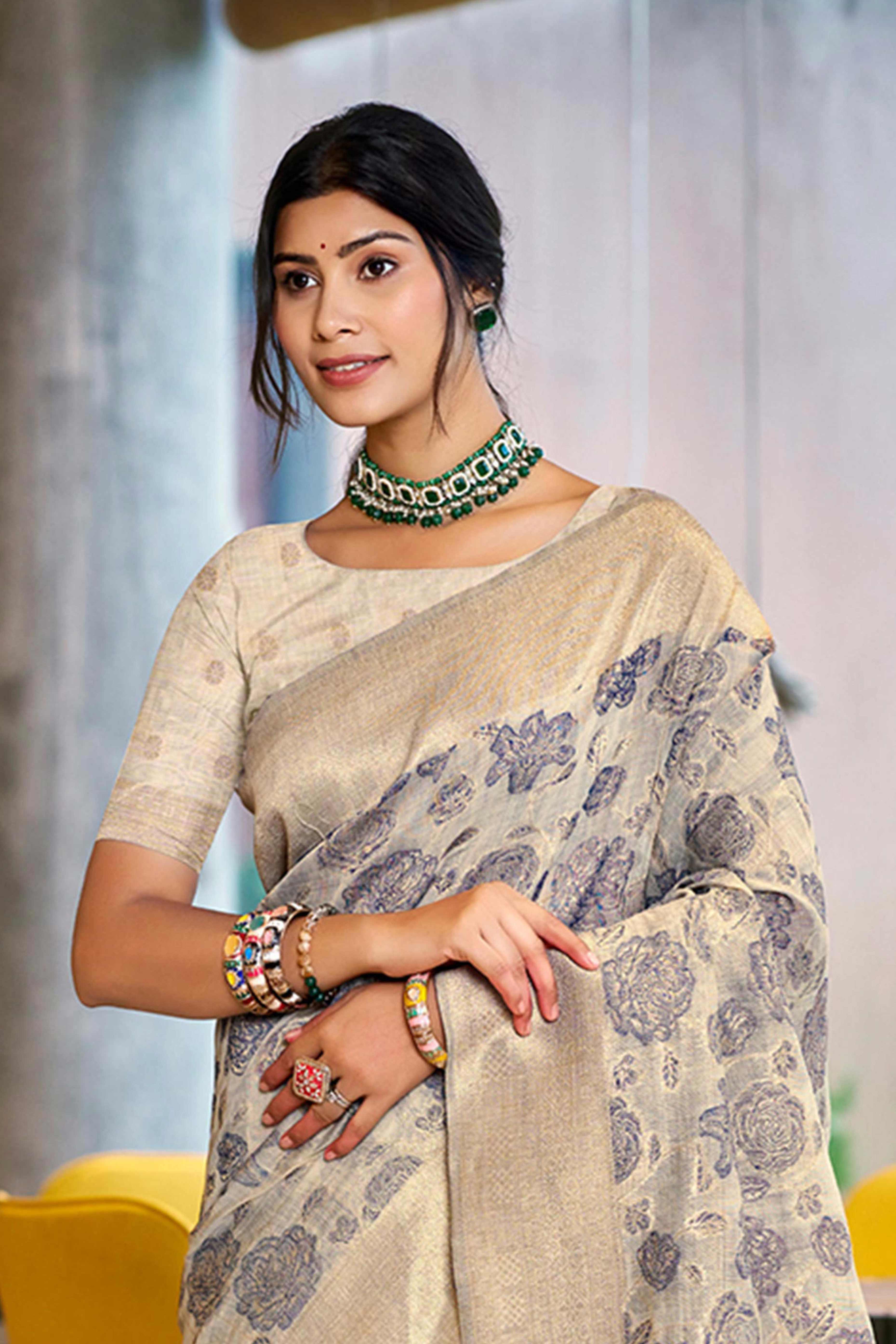 Grey Premium Cotton Silk Saree Highlighted With Floral Weaving Work & Tassel Pallu