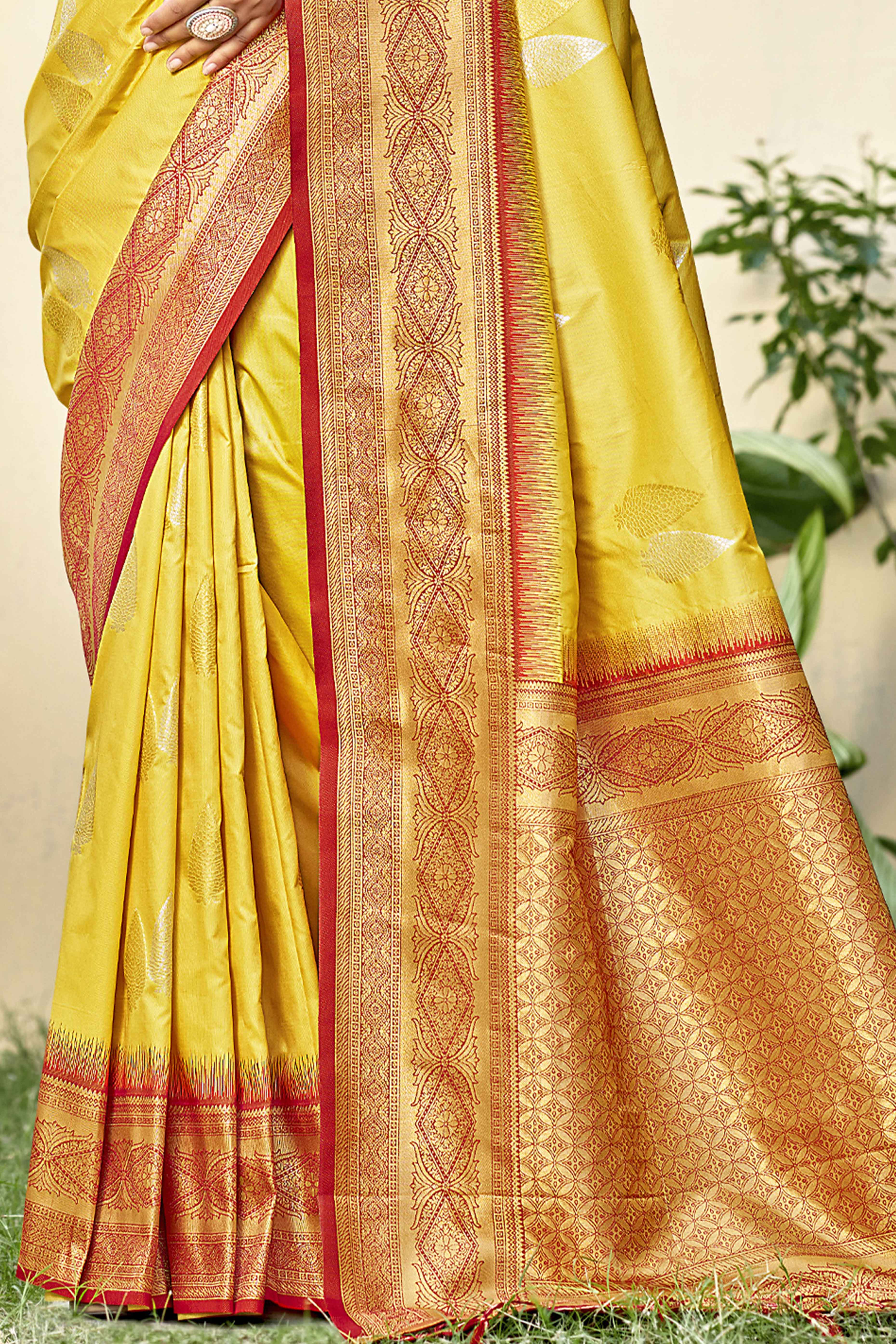 Yellow Woven Banarasi Silk Saree With Tassels