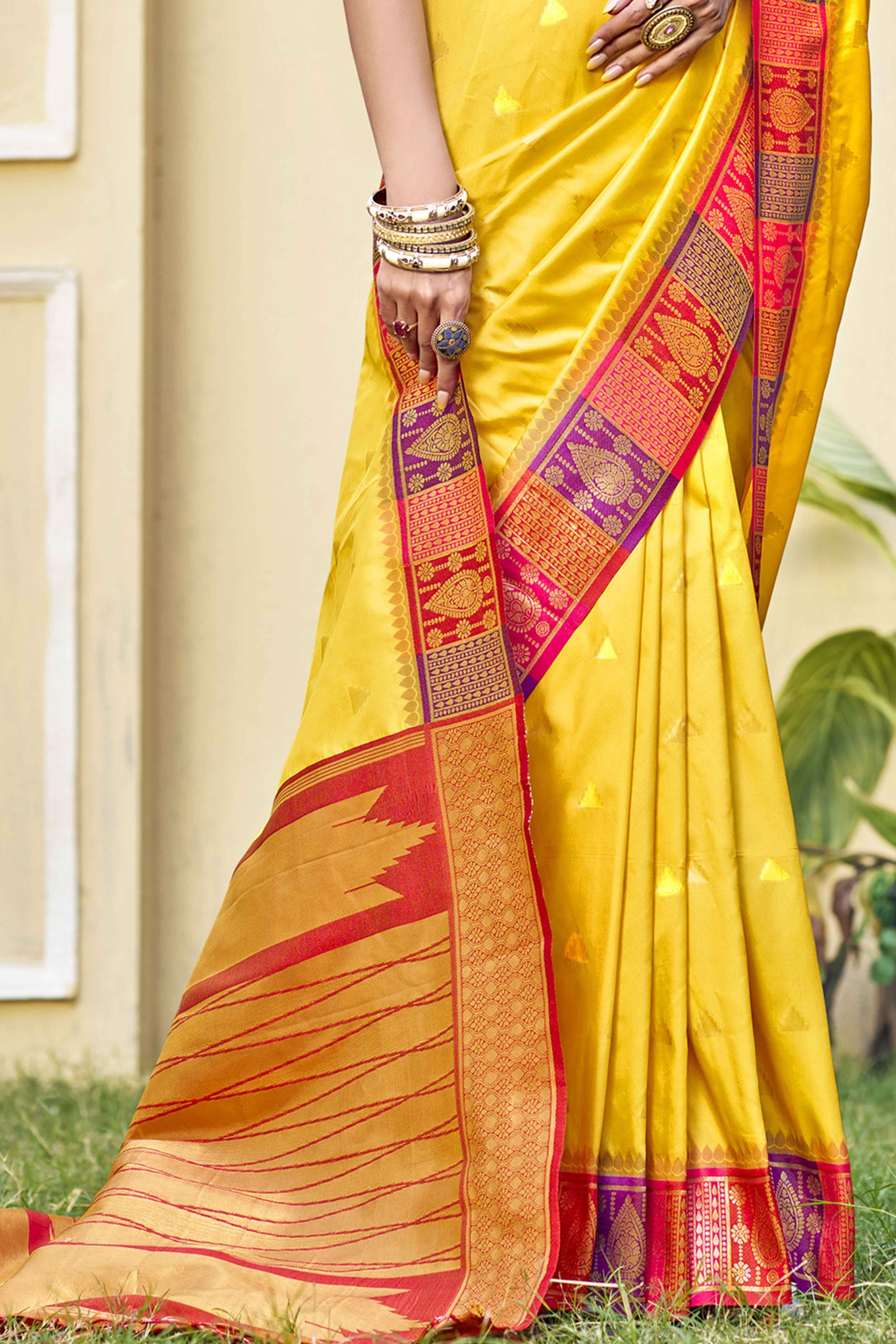 Yellow Woven Banarasi Silk Saree With Tassels