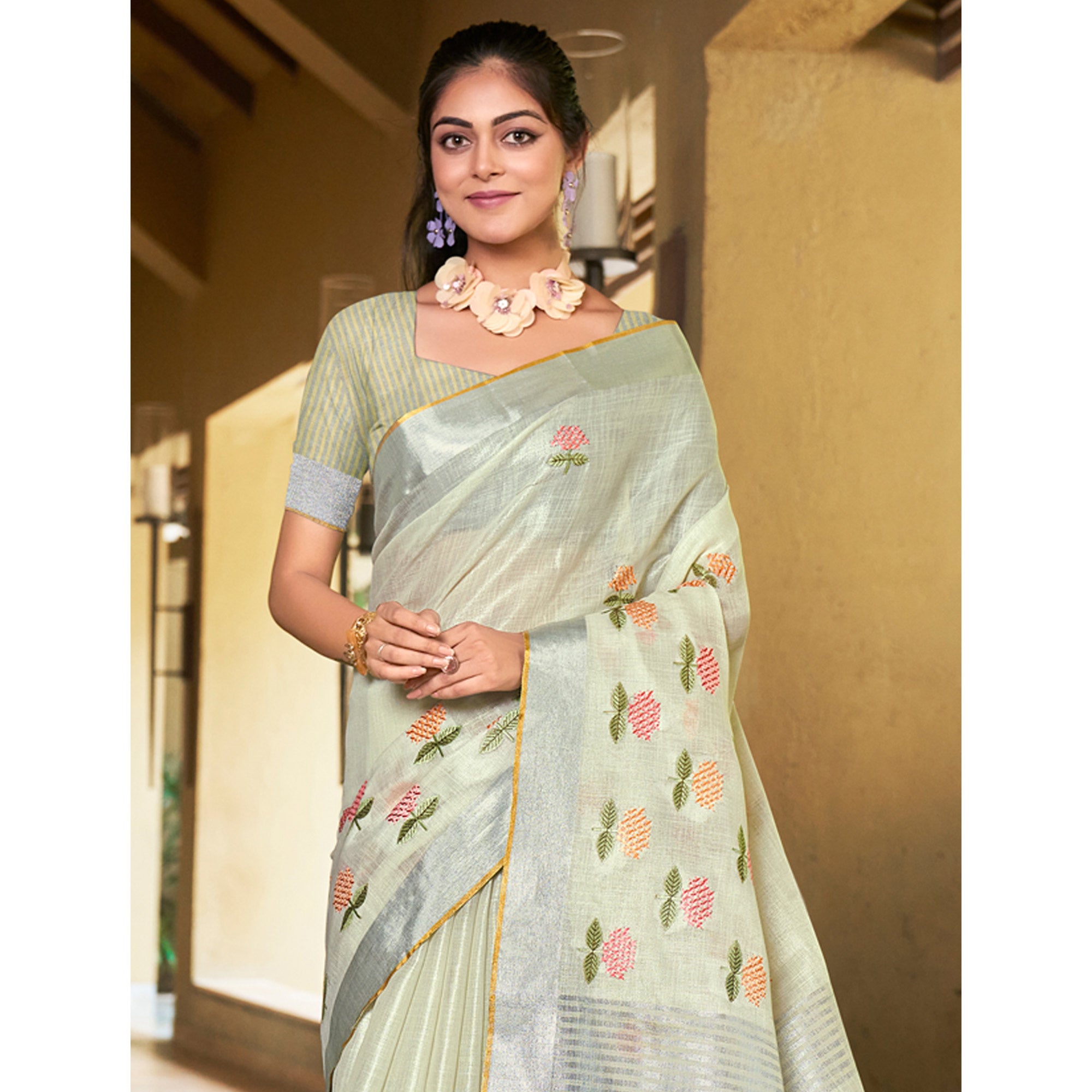 Pale Yellow Floral Embroidered Linen Saree With Tassels
