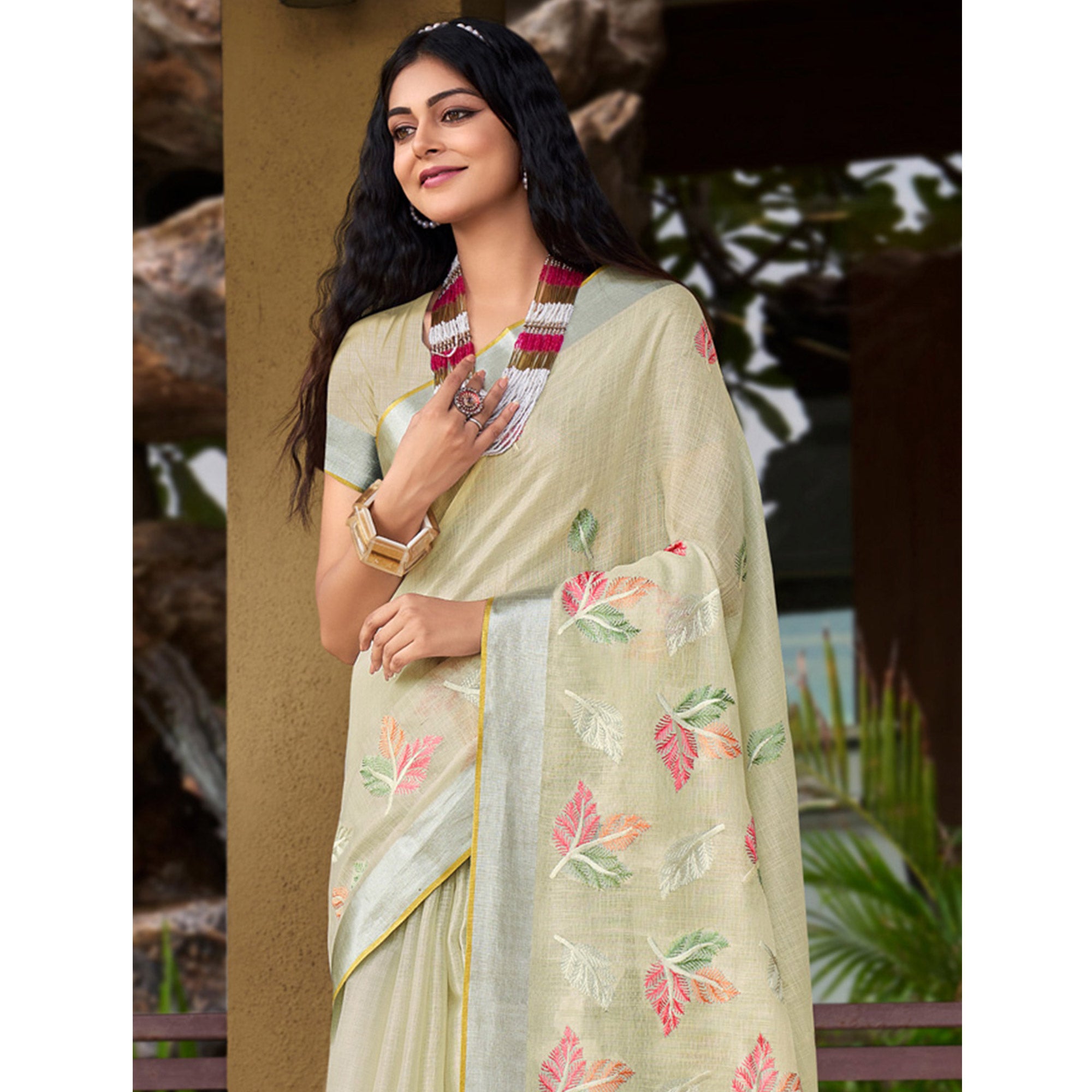 Pale Yellow Floral Embroidered Linen Saree With Tassels