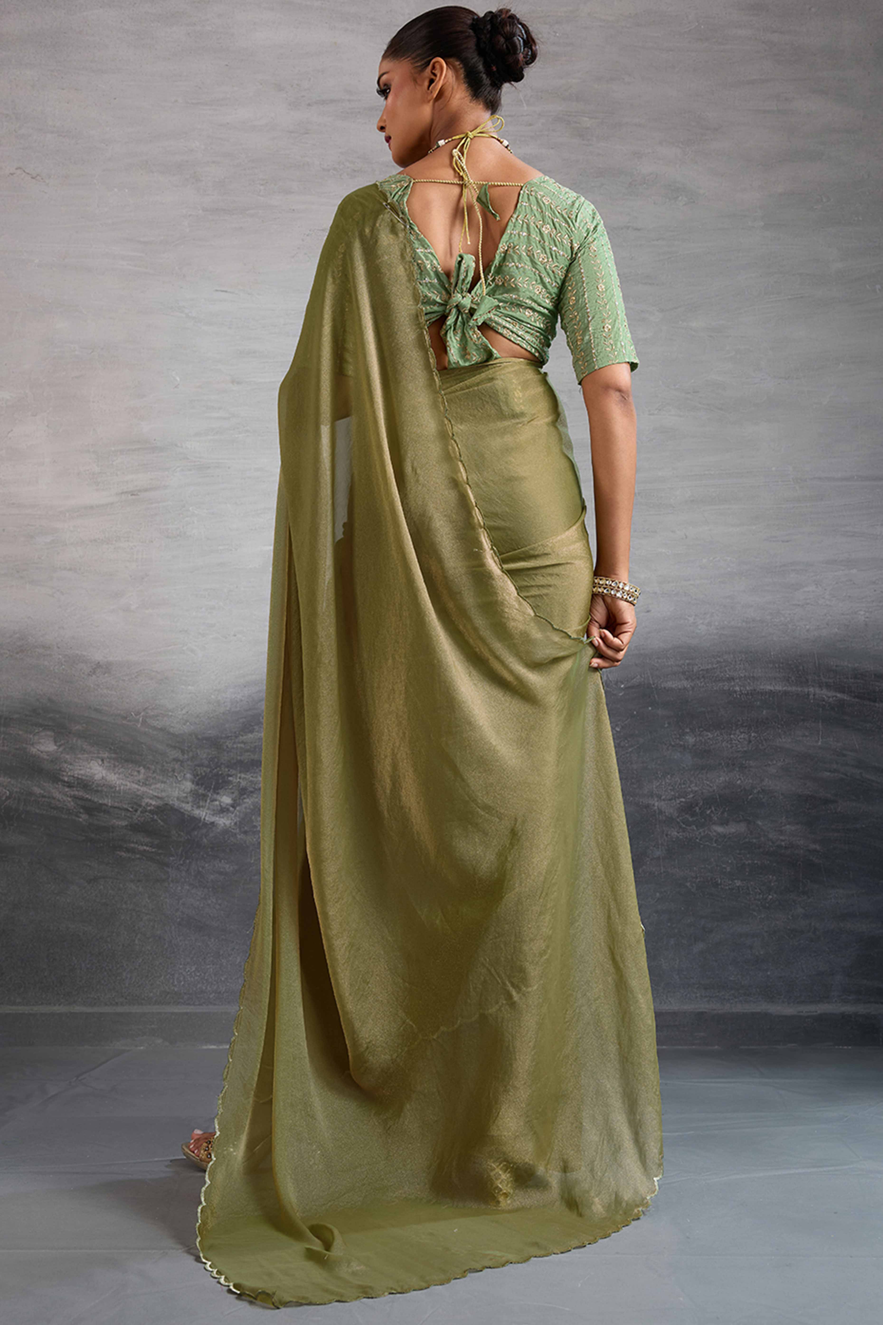 Light Olive Green Solid Organza Jimmy Choo Saree Accentuated With Elegant Cutwork Border Detailing