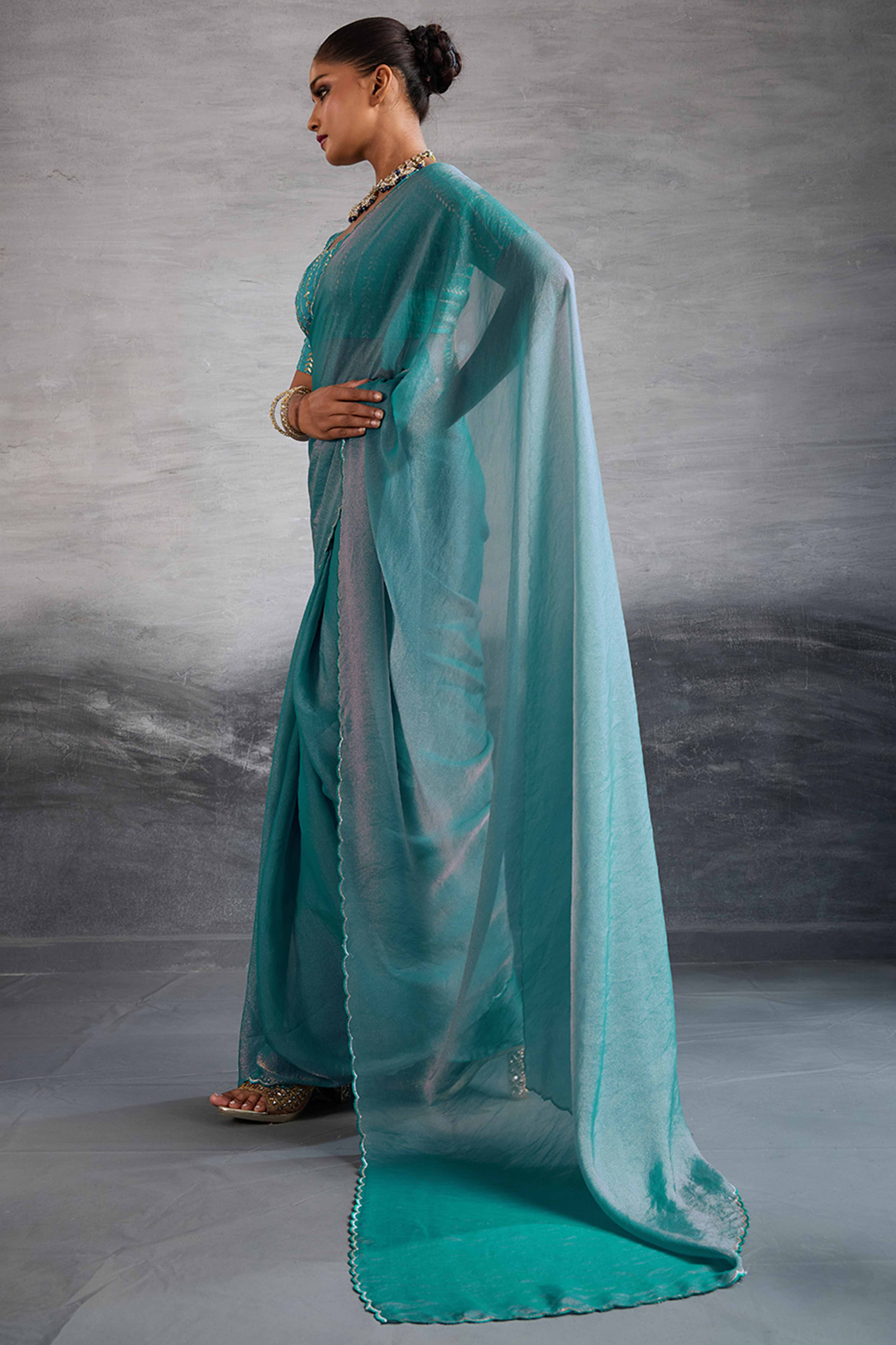 Turquoise Solid Organza Jimmy Choo Saree Accentuated With Elegant Cutwork Border Detailing